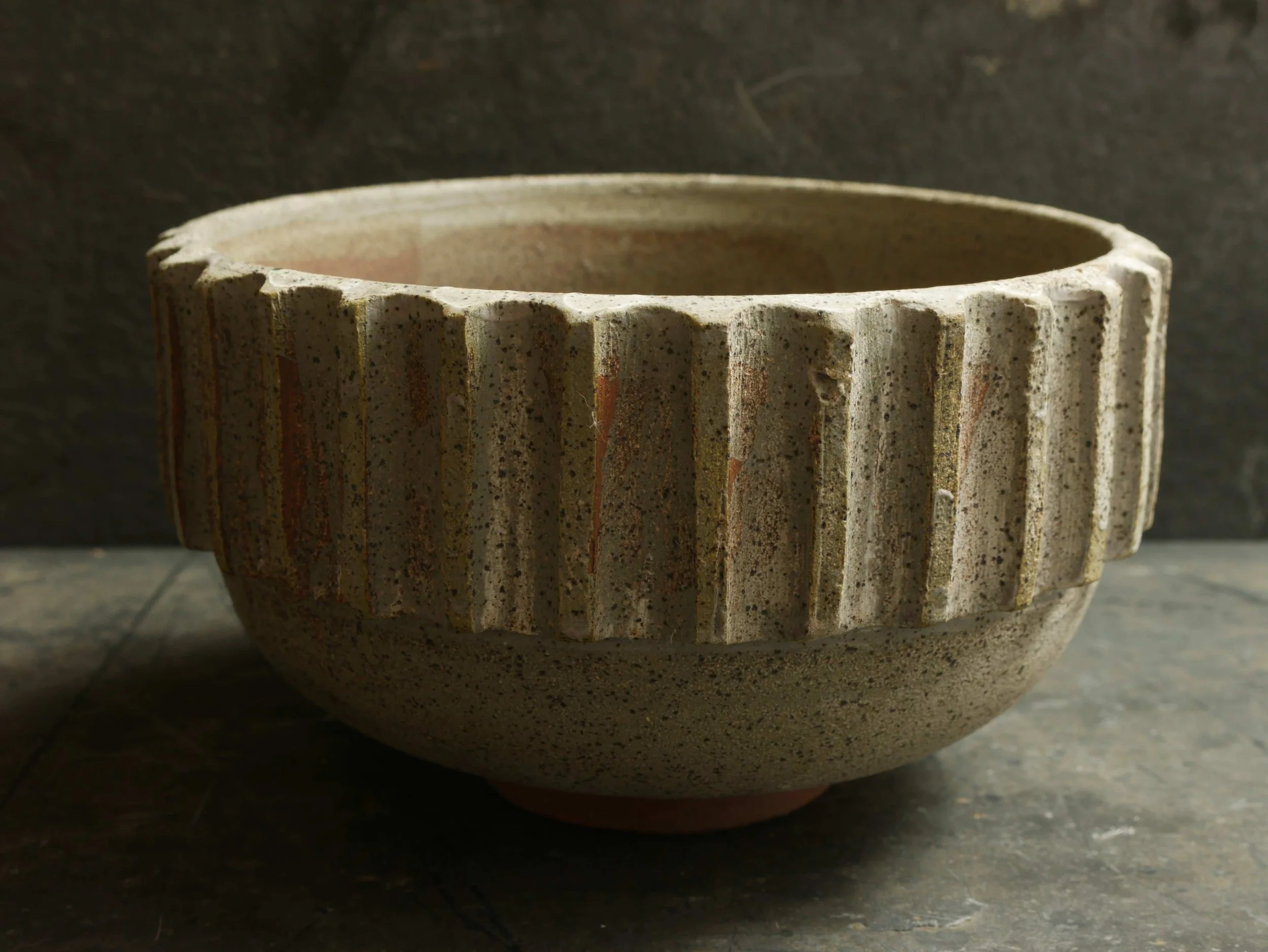 cog design around rim of bowl by Andy van Vliet