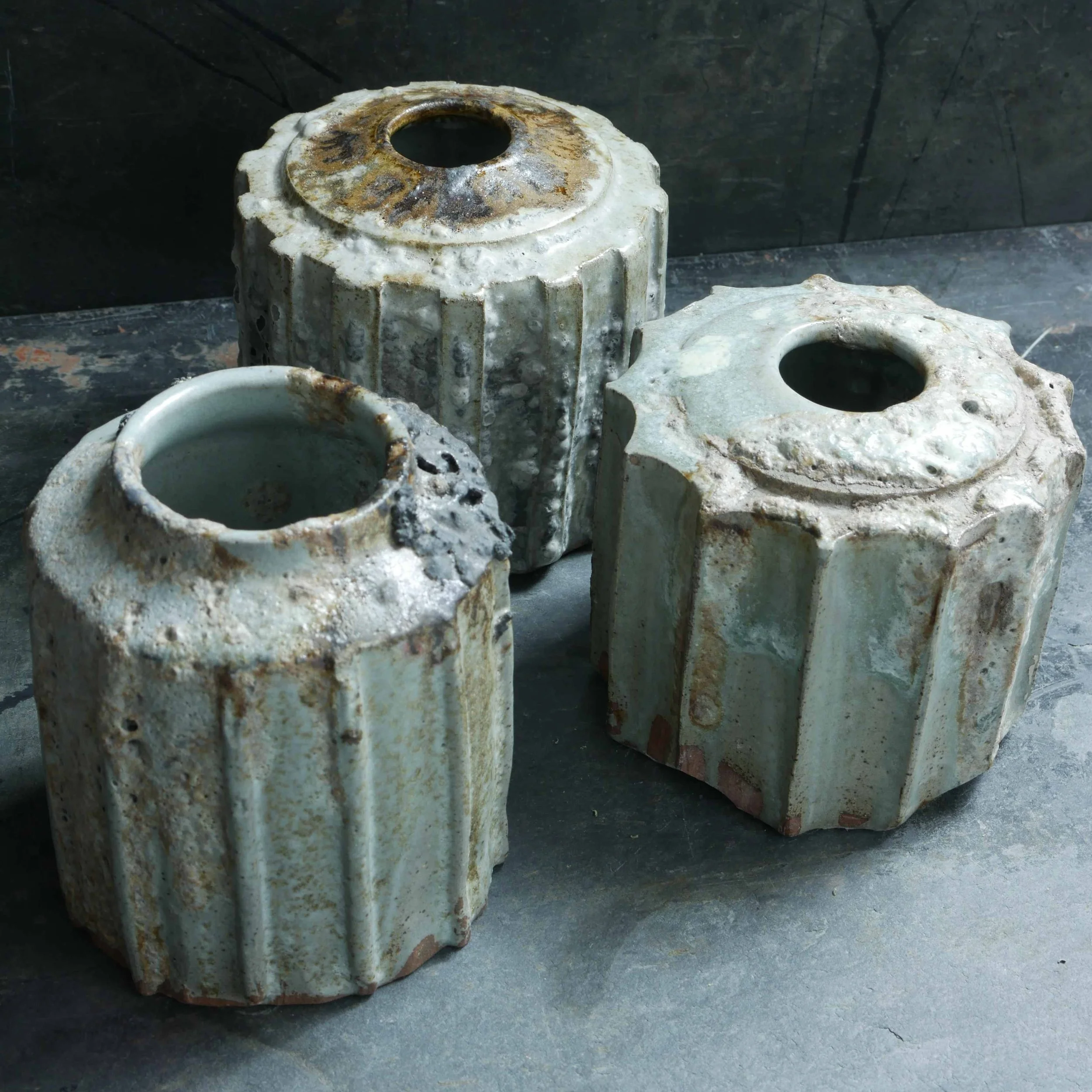 group of experimental cog and rib pots in Japanese-style celadon green glazes by Andy van Vliet