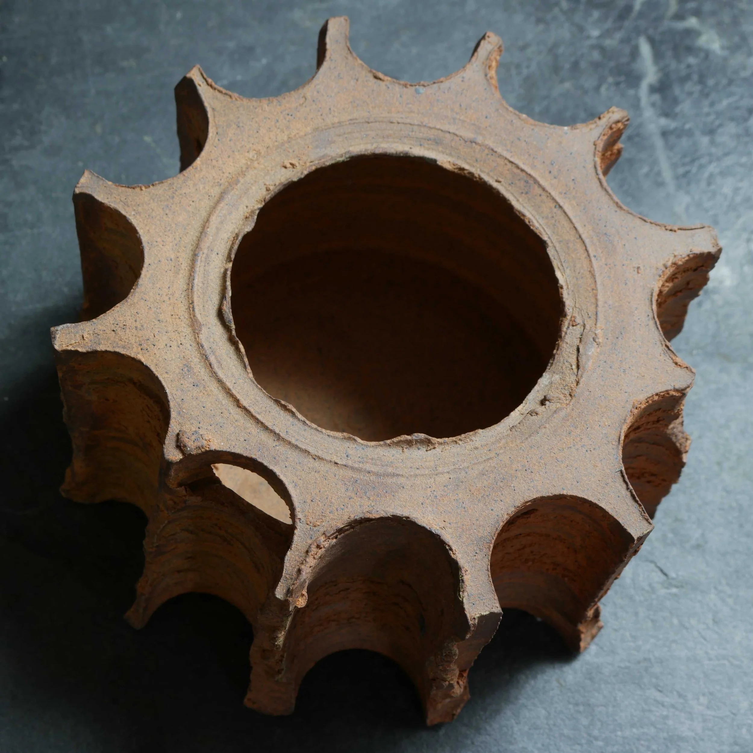 raw brown star shaped pot by Andy van Vliet