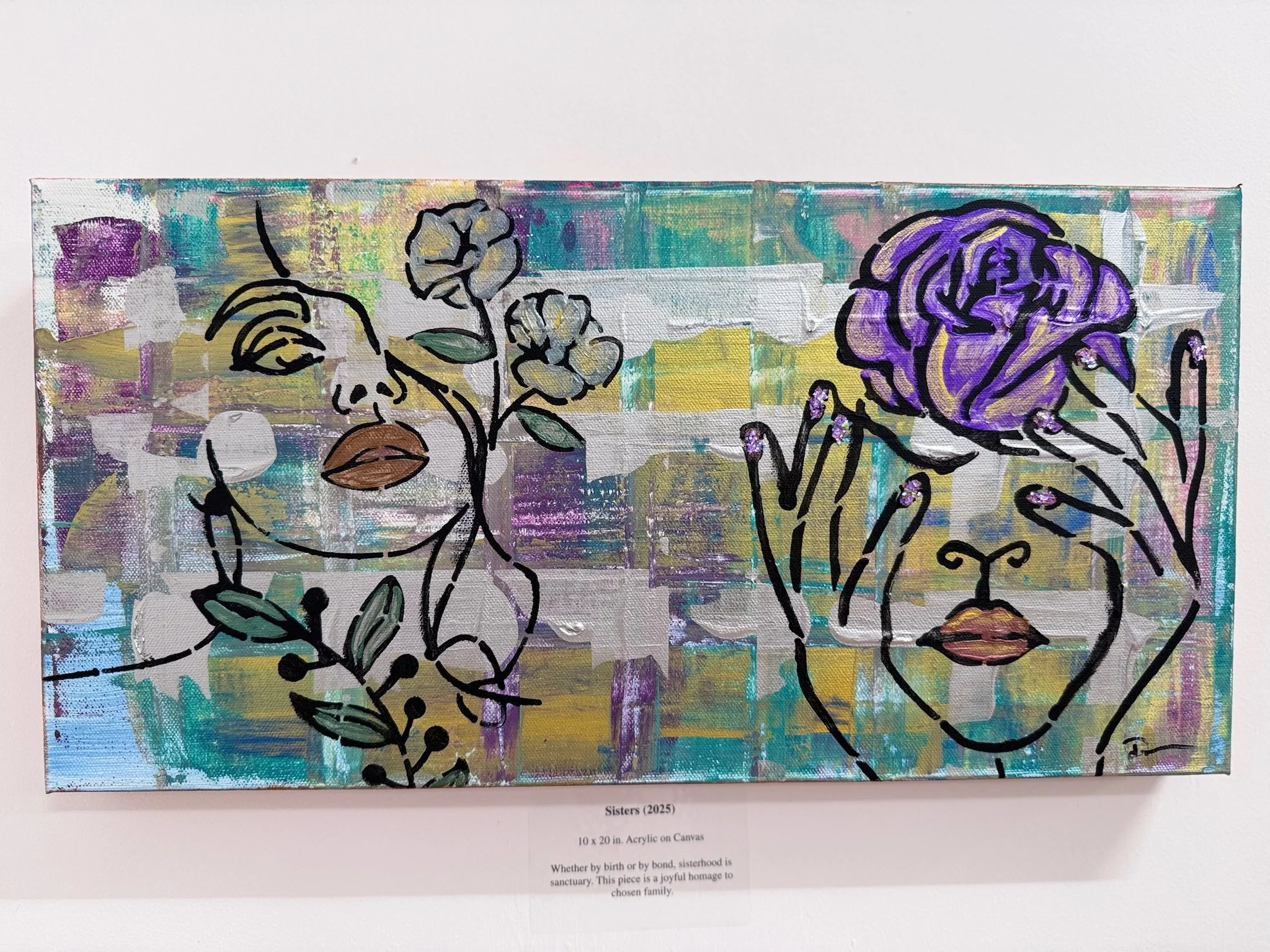 Abstract painting titled 'Sisters (2025)' depicting two female faces in side profile outlined with black lines, surrounded by flowers and foliage, on a colorful, textured background.