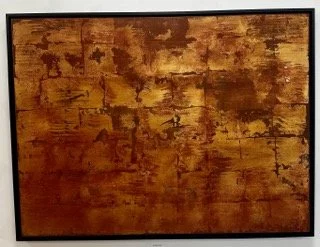 Abstract painting with warm tones of gold, brown, and reddish hues, featuring textured, layered brushstrokes.