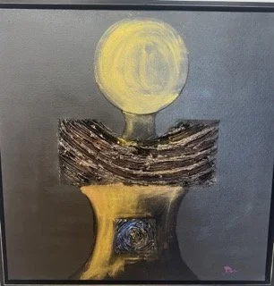 Abstract painting featuring a yellow circle above a textured dark shape and a golden element at the bottom, set against a gray background.