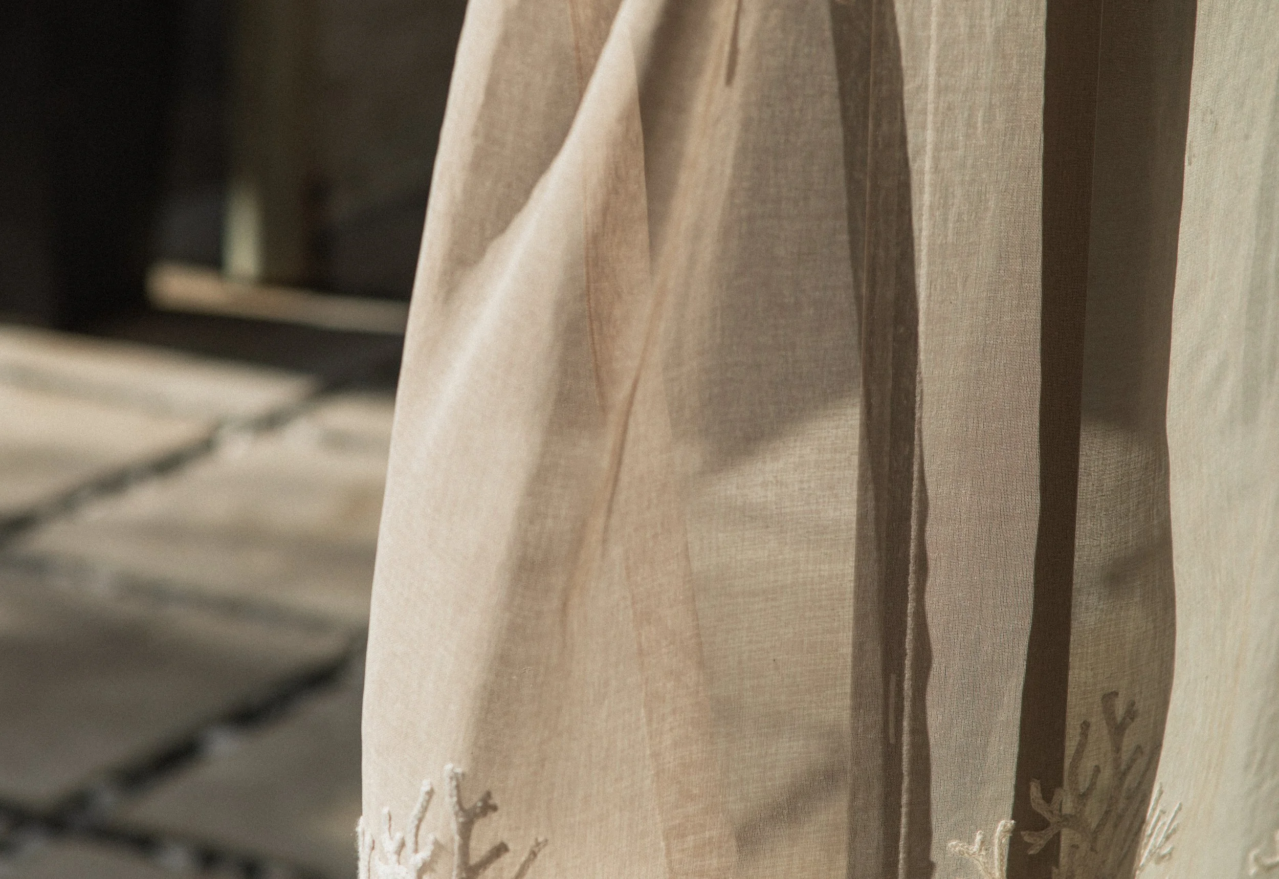 Close-up of a brown paper bag hanging on a display rack.