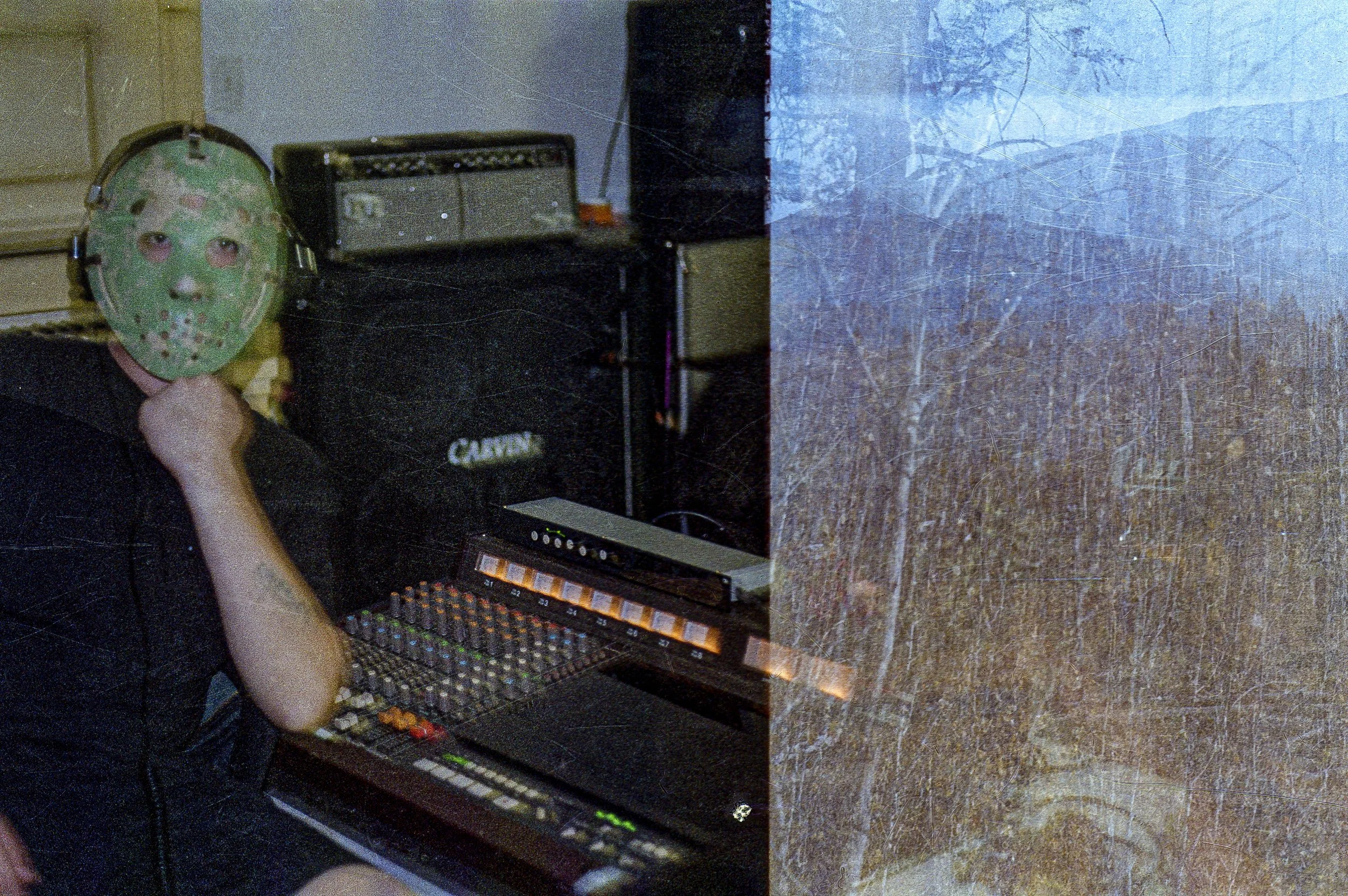 Image of Dantana in a hockey mask sitting at our Tascam 388.