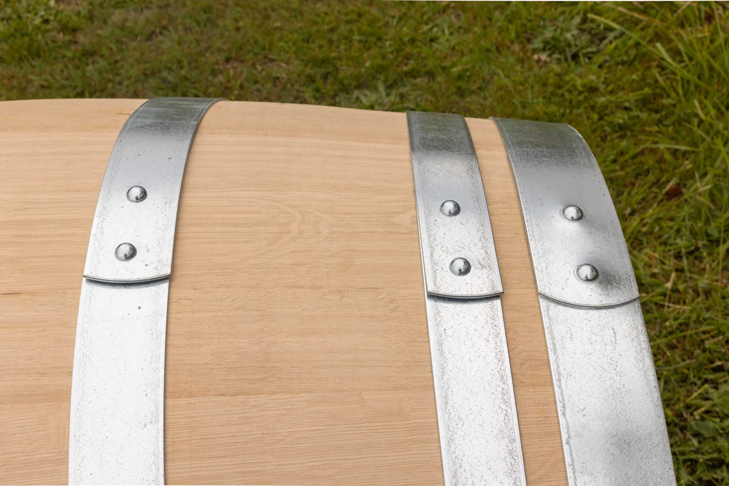 Brand new Barrel Co wine barrel showing close up of oak and barrel hoops