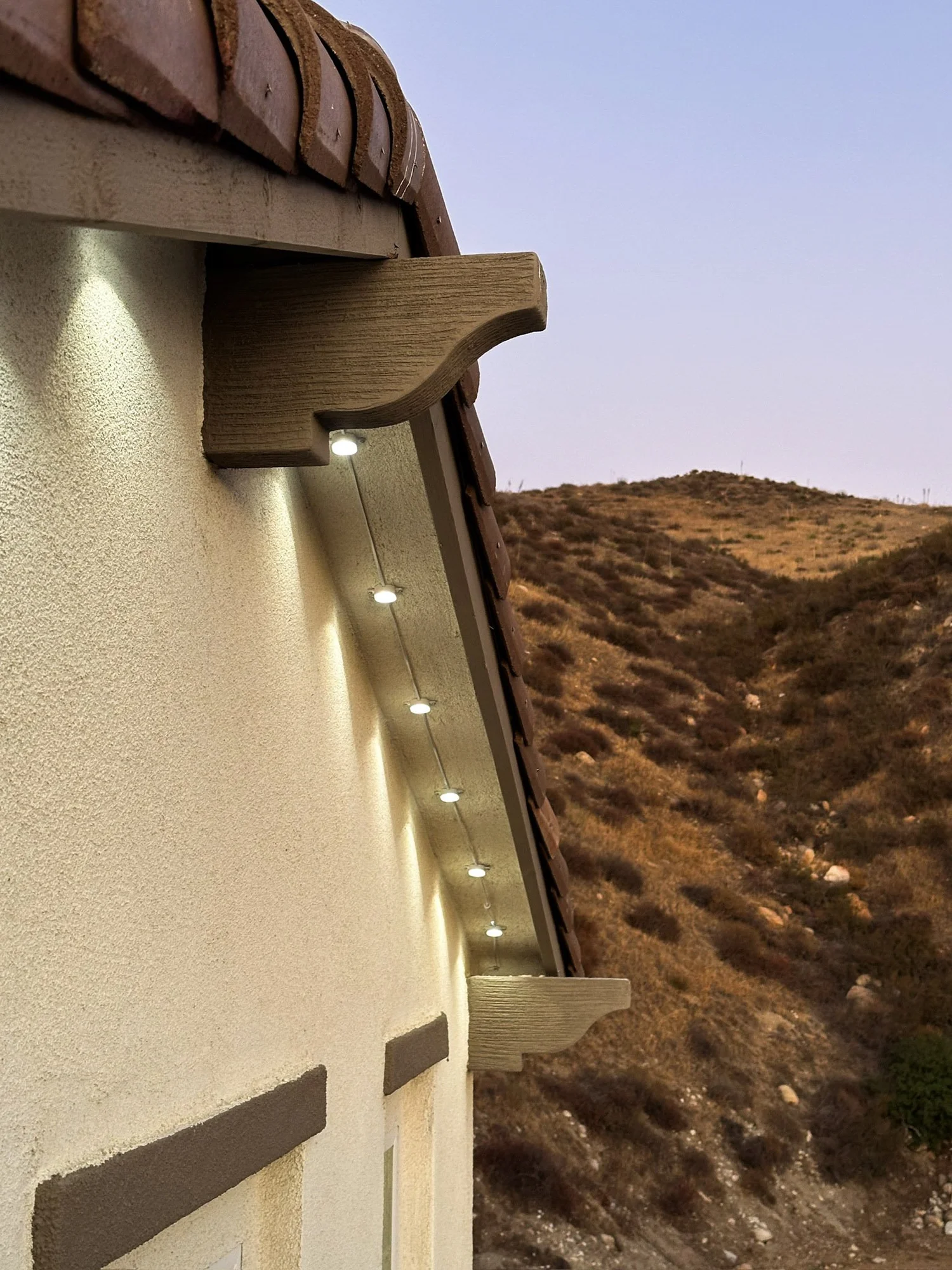 3D-printed LED light clip mounted on eave for Govee permanent lighting installation