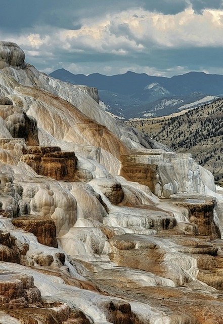 A brown and white wall of rock formations in Yellowstone National Park
