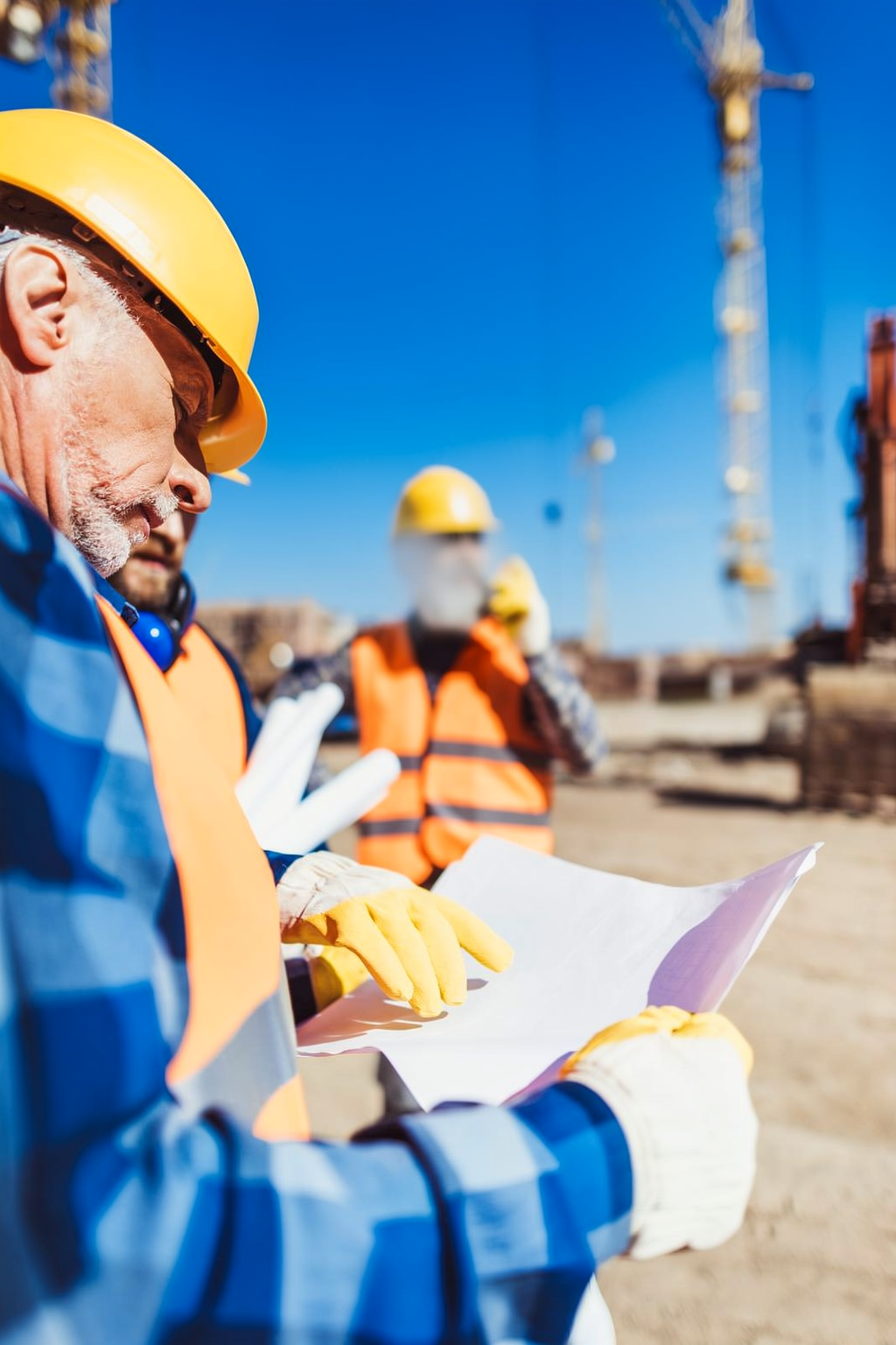 Construction professionals reviewing repair estimates to ensure clear communication and code-compliant repairs