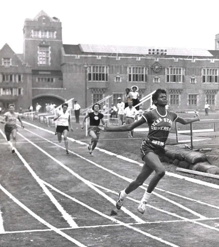Archival photograph of a Tennessee State University runner crossing the finish line