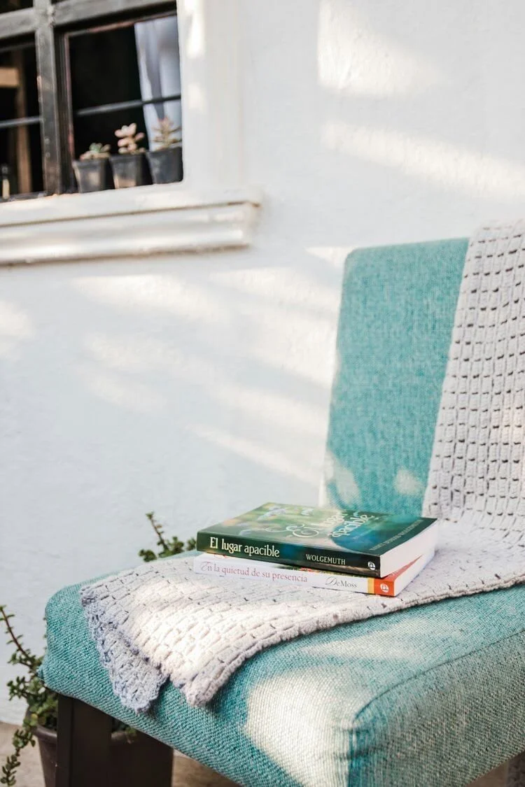 Even inviting spaces for rest, like a cozy chair with books, can feel out of reach when high-functioning anxiety makes slowing down feel impossible.