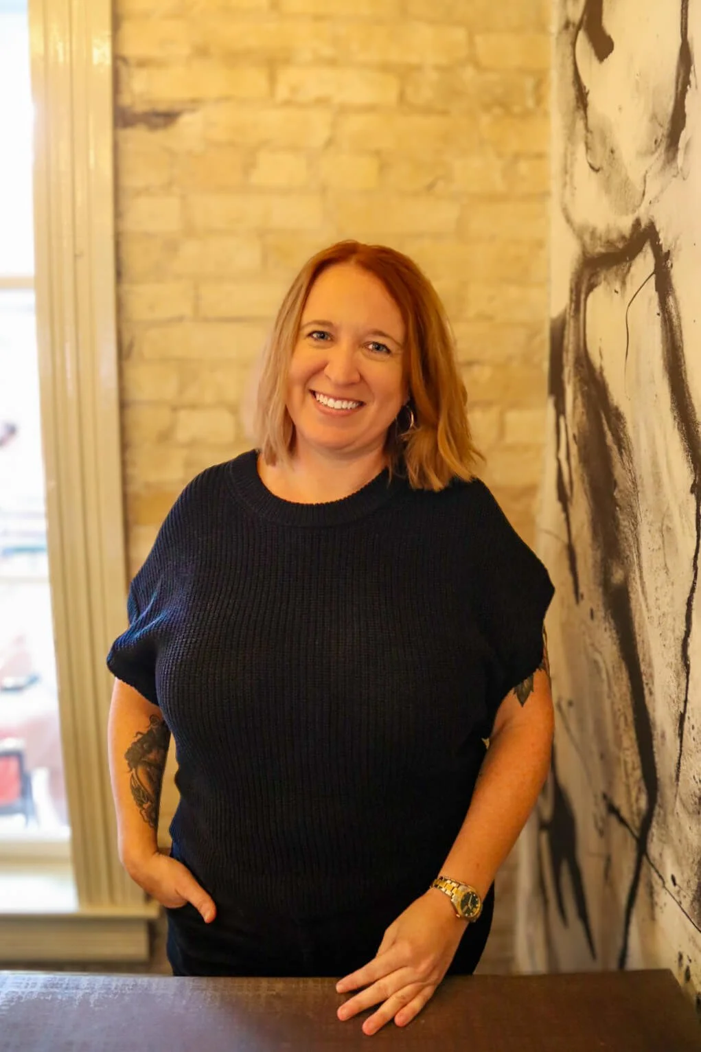 Therapist standing in a calm office setting, representing professional support for high-functioning anxiety therapy in Austin, Texas