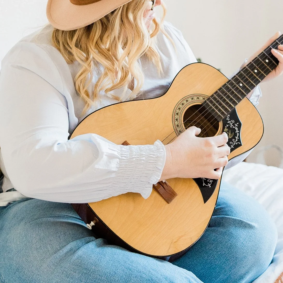woman playing guitar