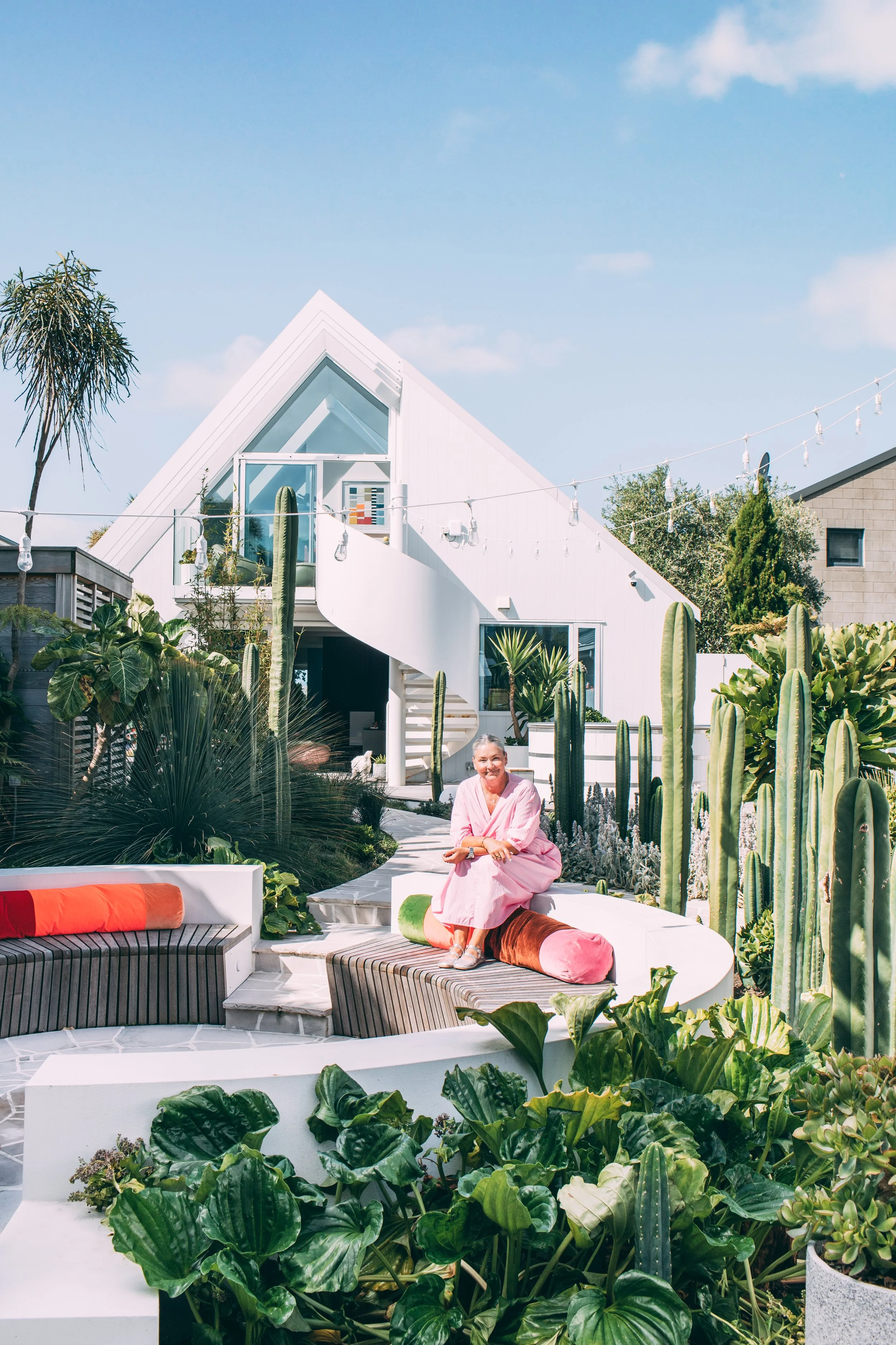 Alex Fulton sits in front of her home in Sumner, Christchurch