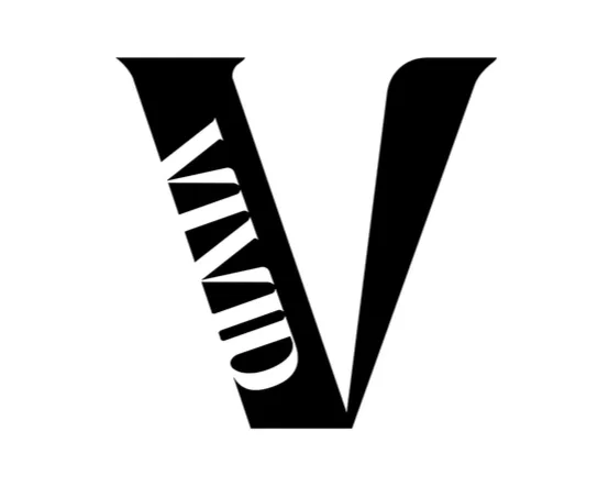 Black letter 'V' with the word 'COMIC' written vertically along the left side