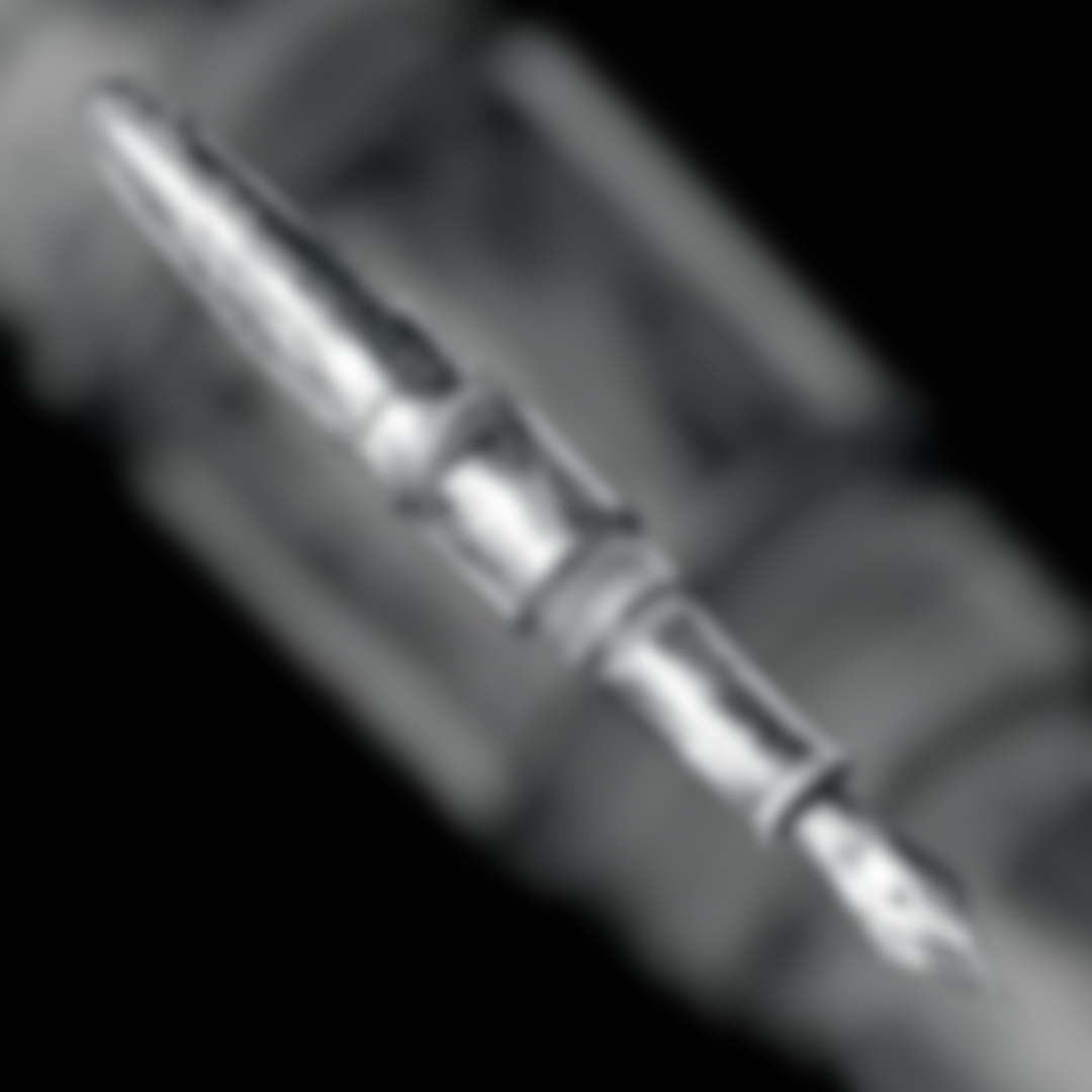 Close-up of a metallic audio jack plugged into a device.