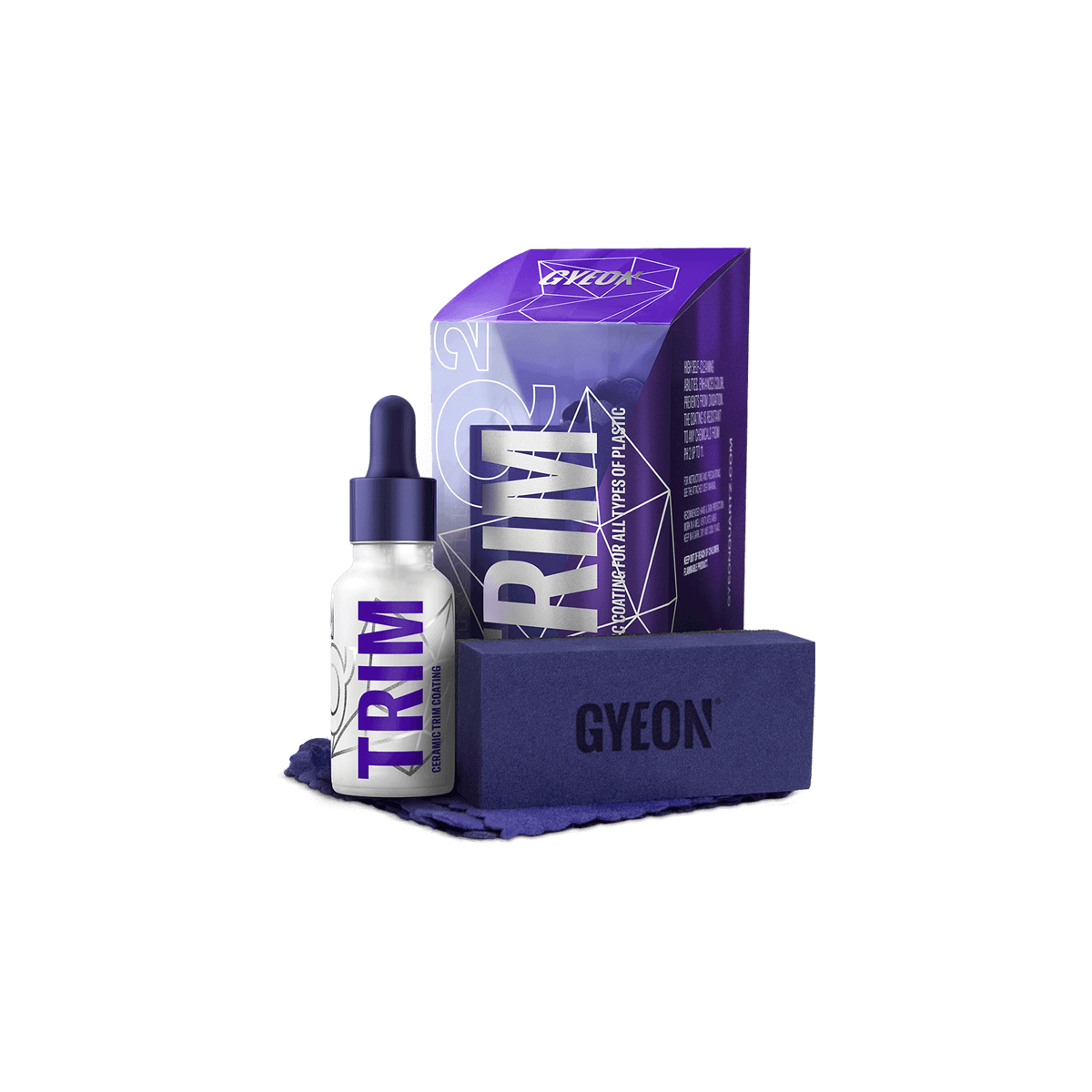 A Gyeon TRIM ceramic paint prep coating bottle, purple and white packaging, a box, and a cloth, all on a black background.