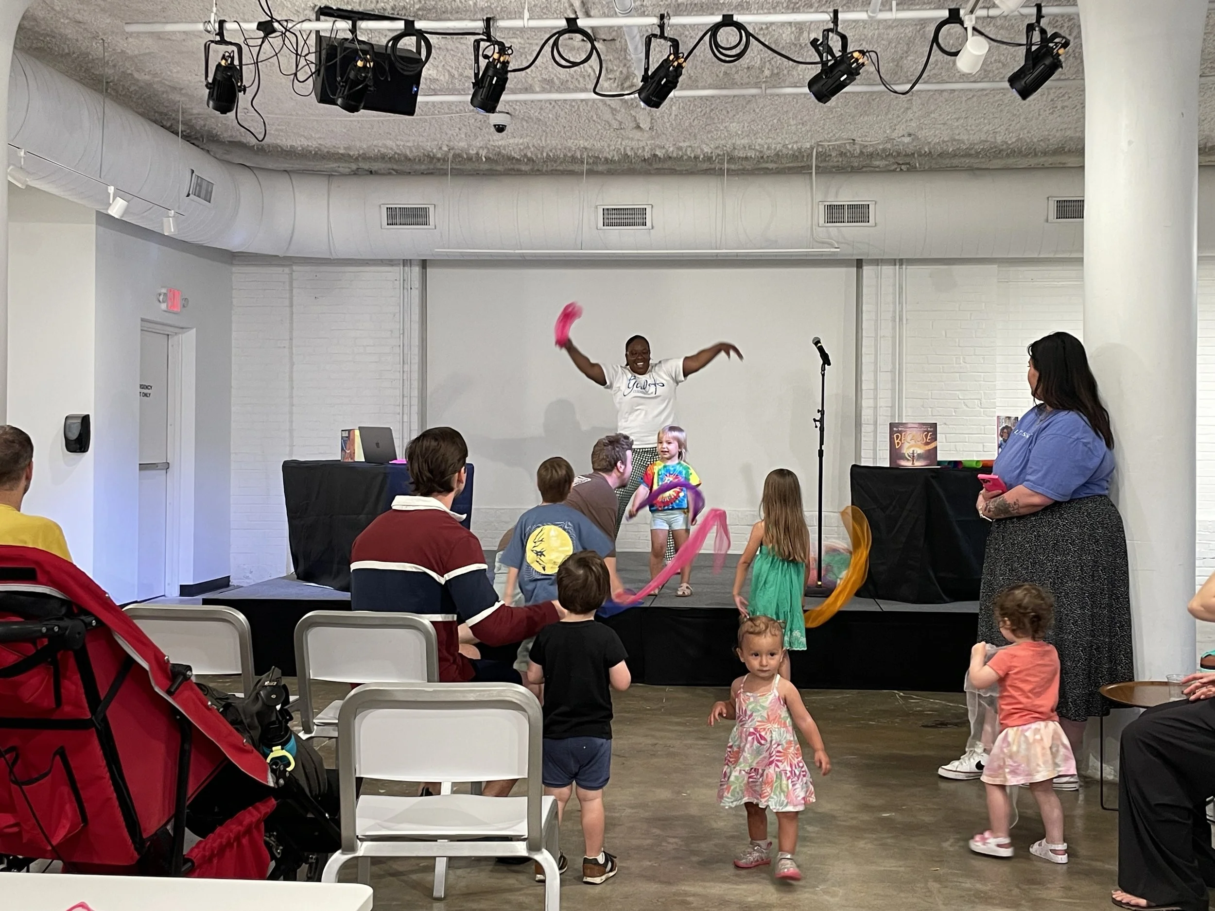 Girl Conductor at KITAD with kids dancing