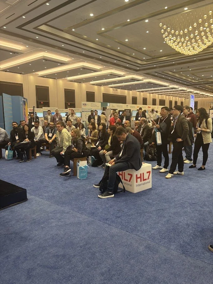 HIMSS25: A central gathering spot for live presentations and dynamic discussions, drawing attendees into real-time conversations about healthcare innovation.