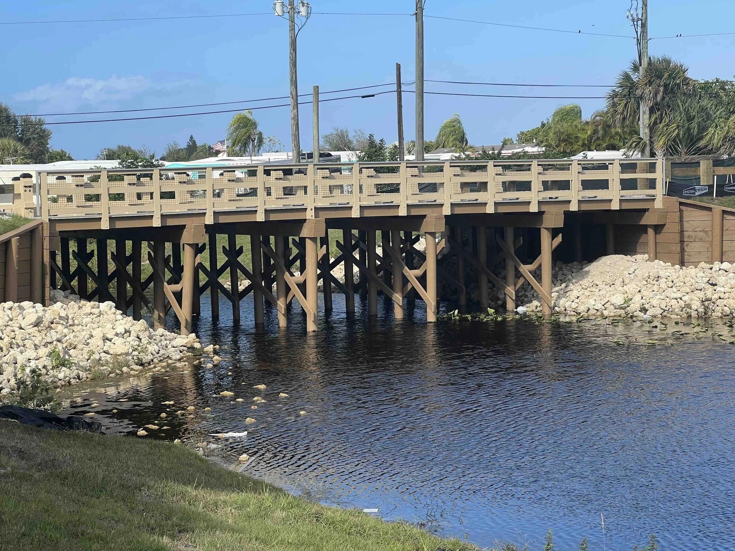 vehicular timber bridge spanning a small waterway