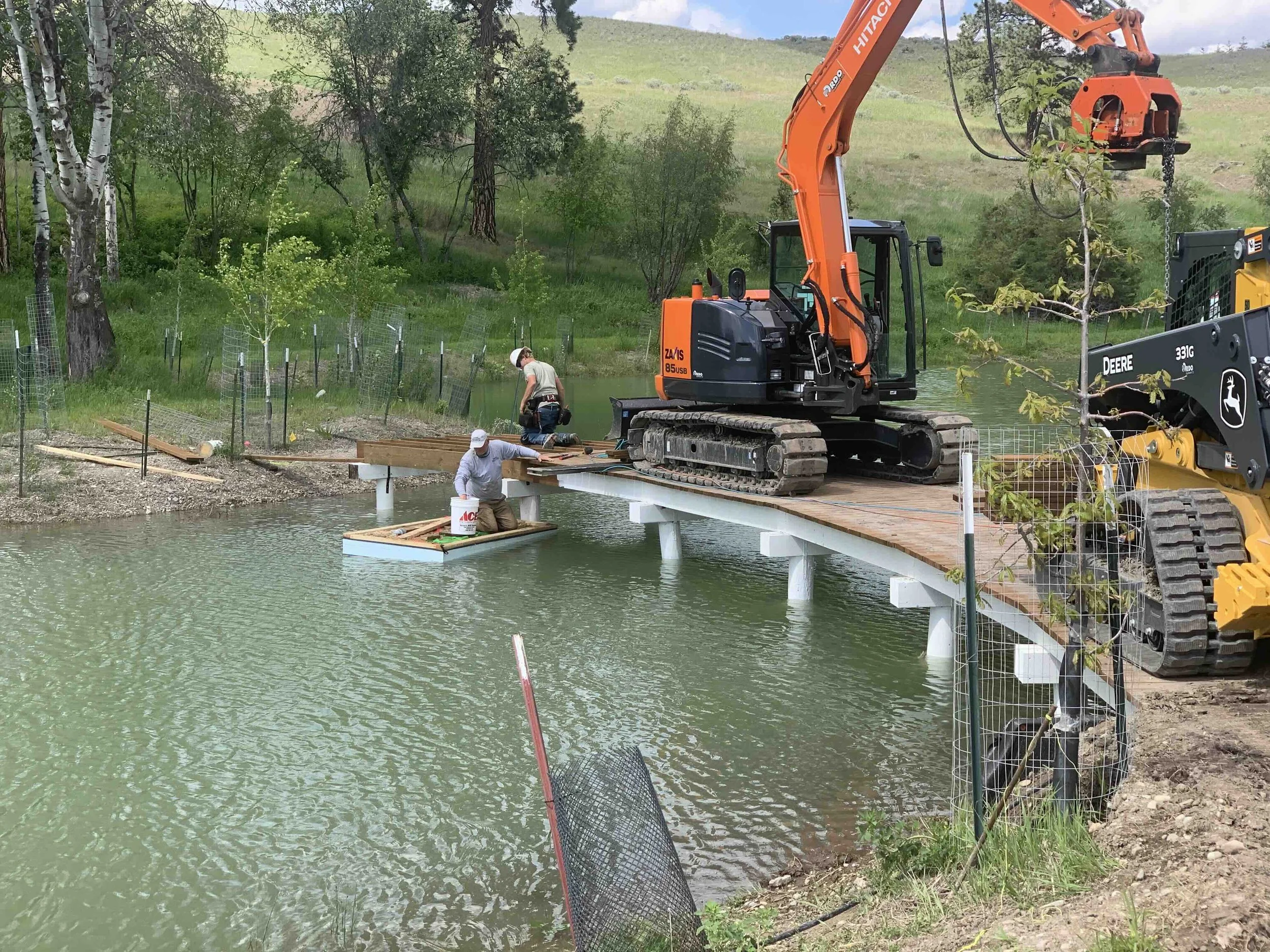 Pedestrian bridge construction over water, timber bridge design