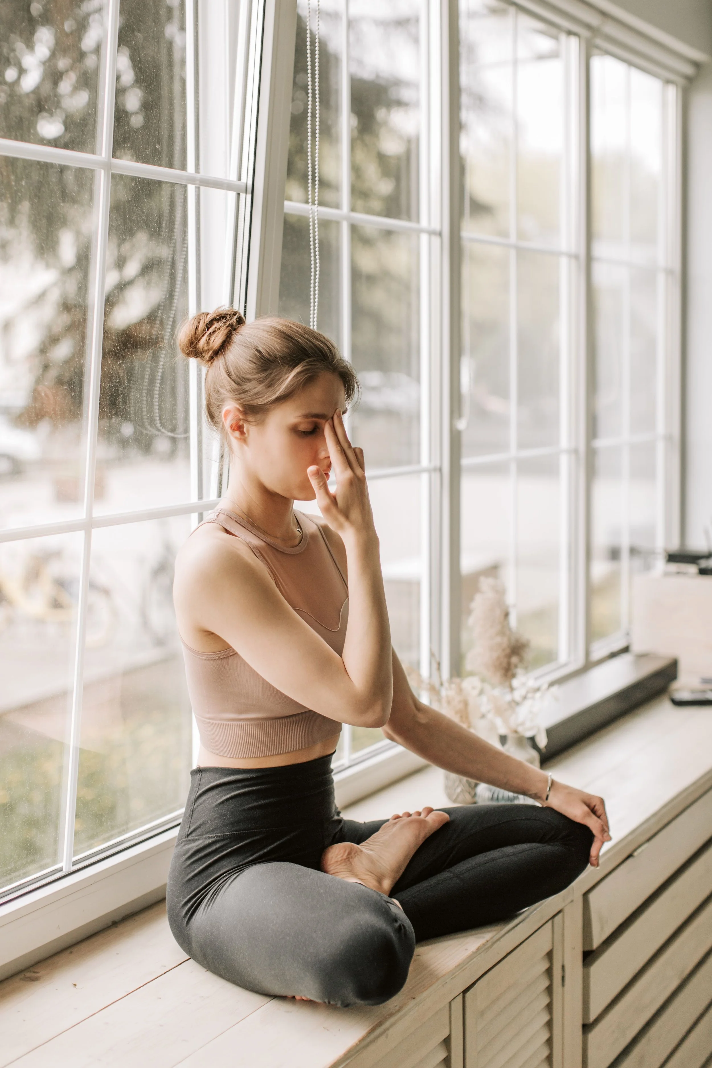 Lady performing Surya Bhedana (sun piercing breath) a powerful pranayama and spiritual tool to activate the yang and heat in the body.