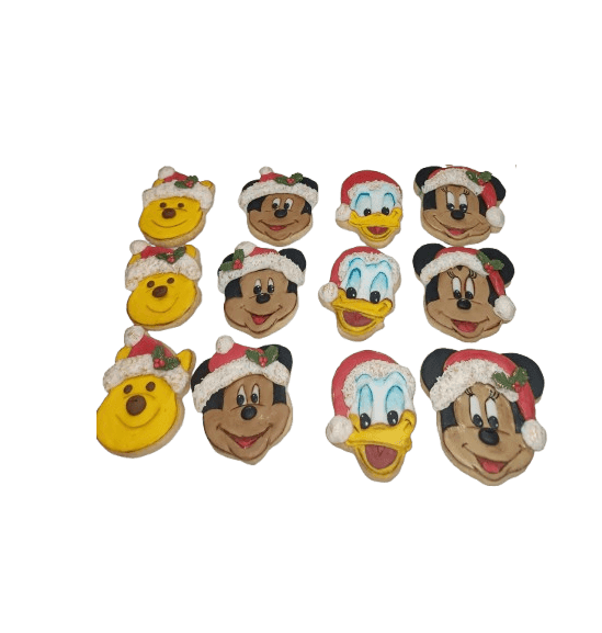 Collection of Christmas-themed cookies shaped like Disney characters, wearing Santa hats and holiday decorations, arranged on a black background.