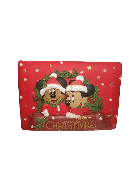 Decorative Christmas card featuring Mickey Mouse and Minnie Mouse wearing Santa hats, with a red background and holiday-themed embellishments, including snowflakes and stars, and the text 'Merry Christmas'.