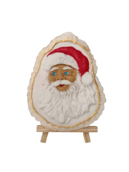 Decorative Santa Claus face with a white beard and red hat, mounted on a wooden stand against a black background.
