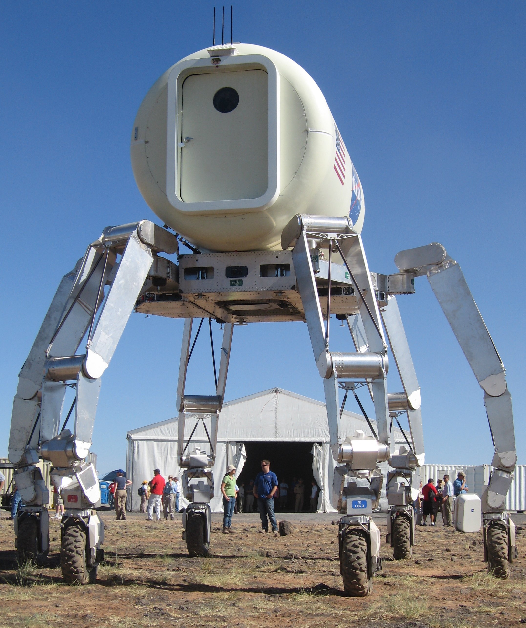 The TriATHLETE robot holding a habitat module.
