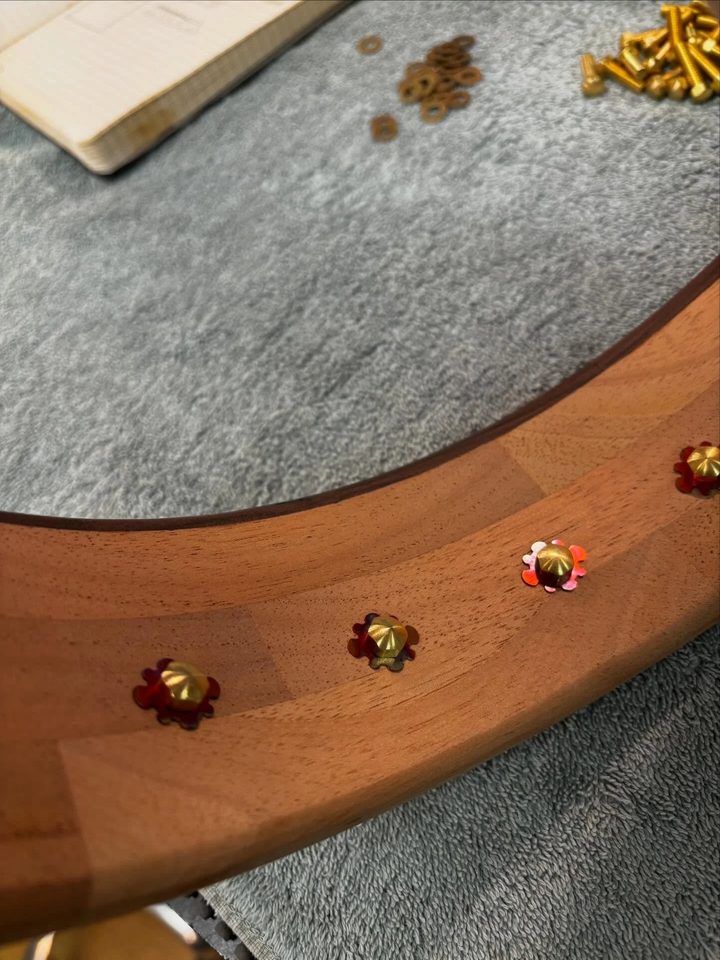 Made some fancy little snowflake washers for this banjo. #banjo #copper #luthiery