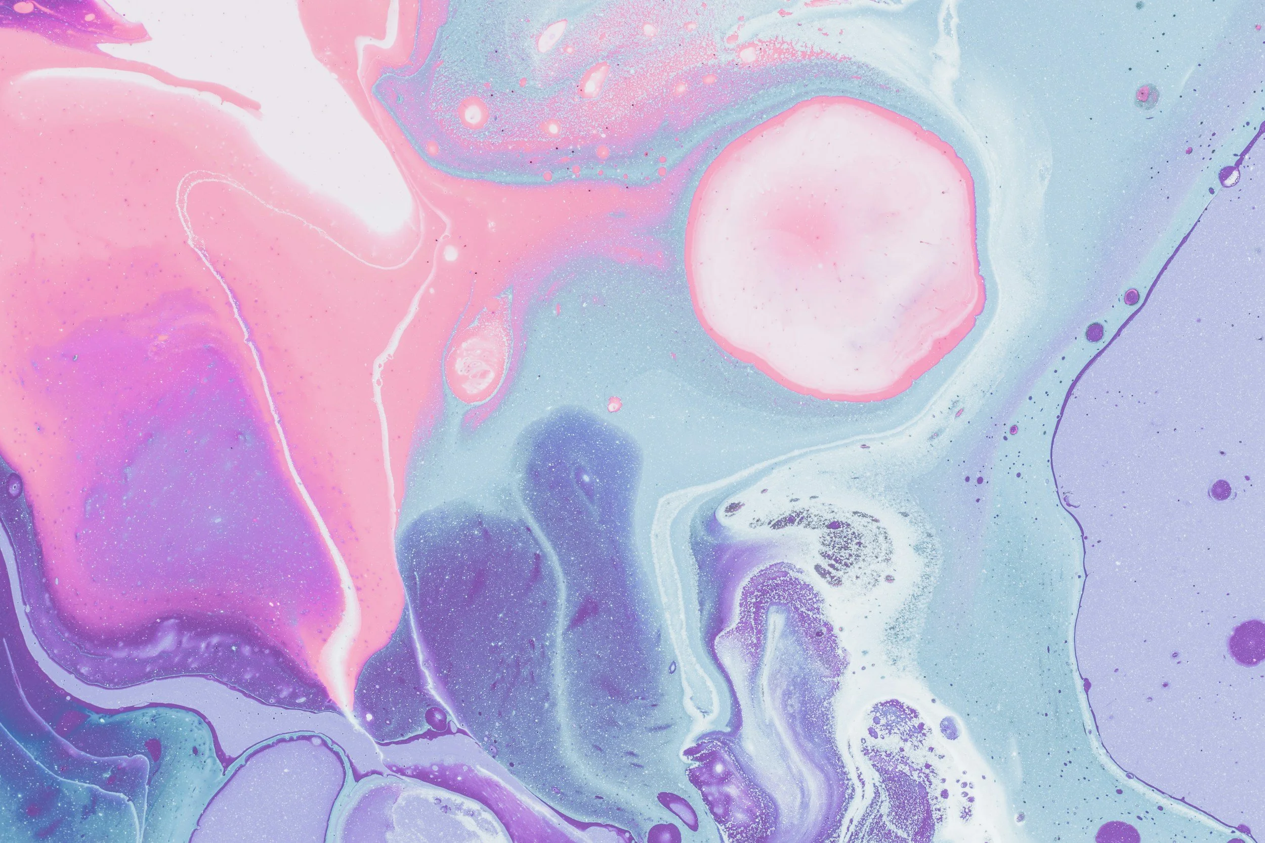 Abstract swirling pastel colors including pink, purple, blue, and white with marble-like patterns.