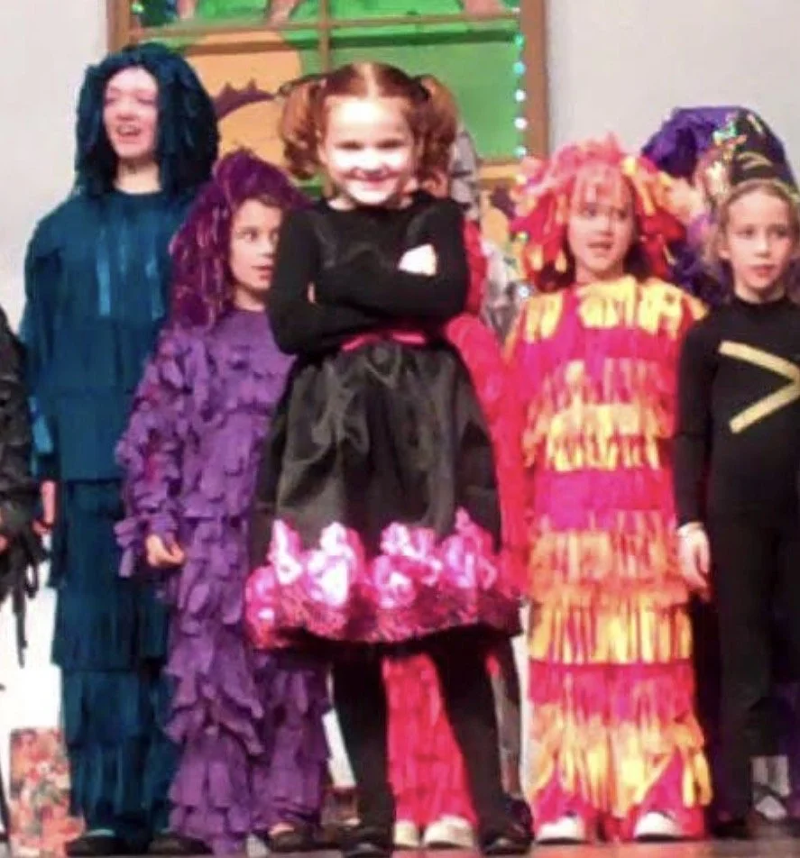 Children dressed in colorful costumes for a Halloween or costume party.