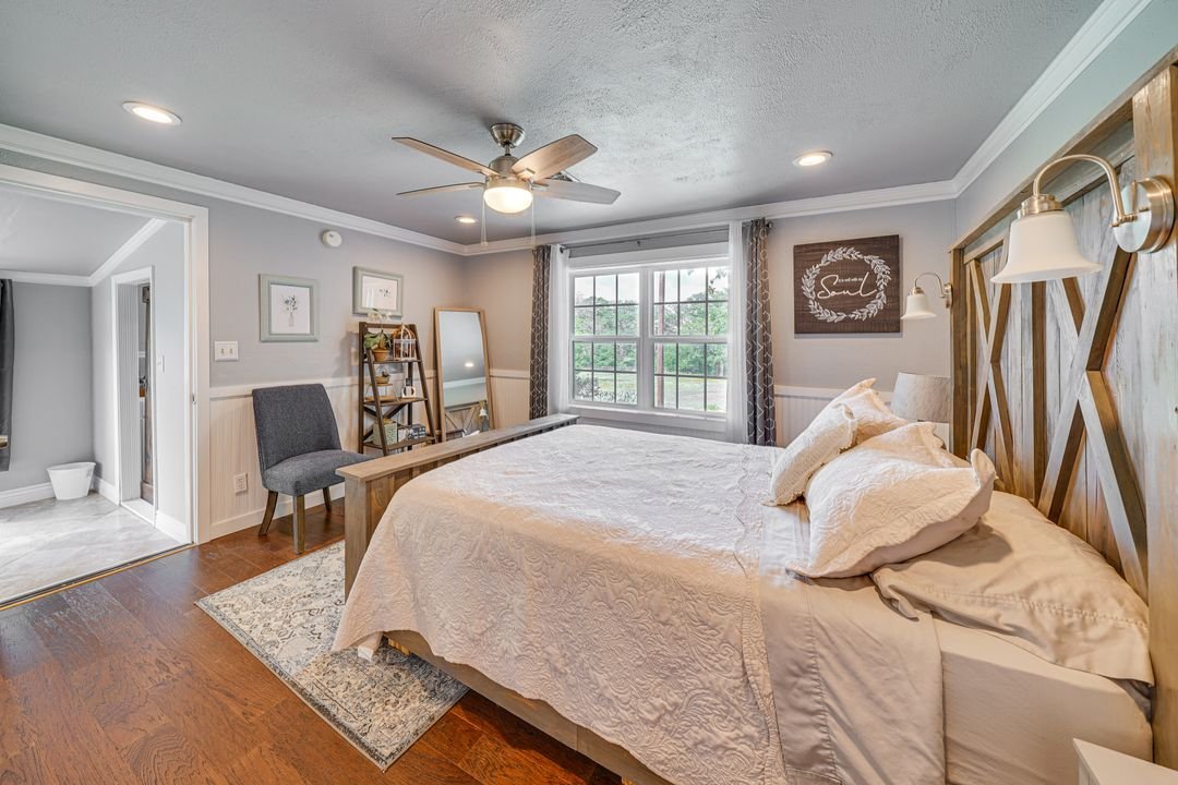 Bedroom 2 with queen bed and access to back sunroom