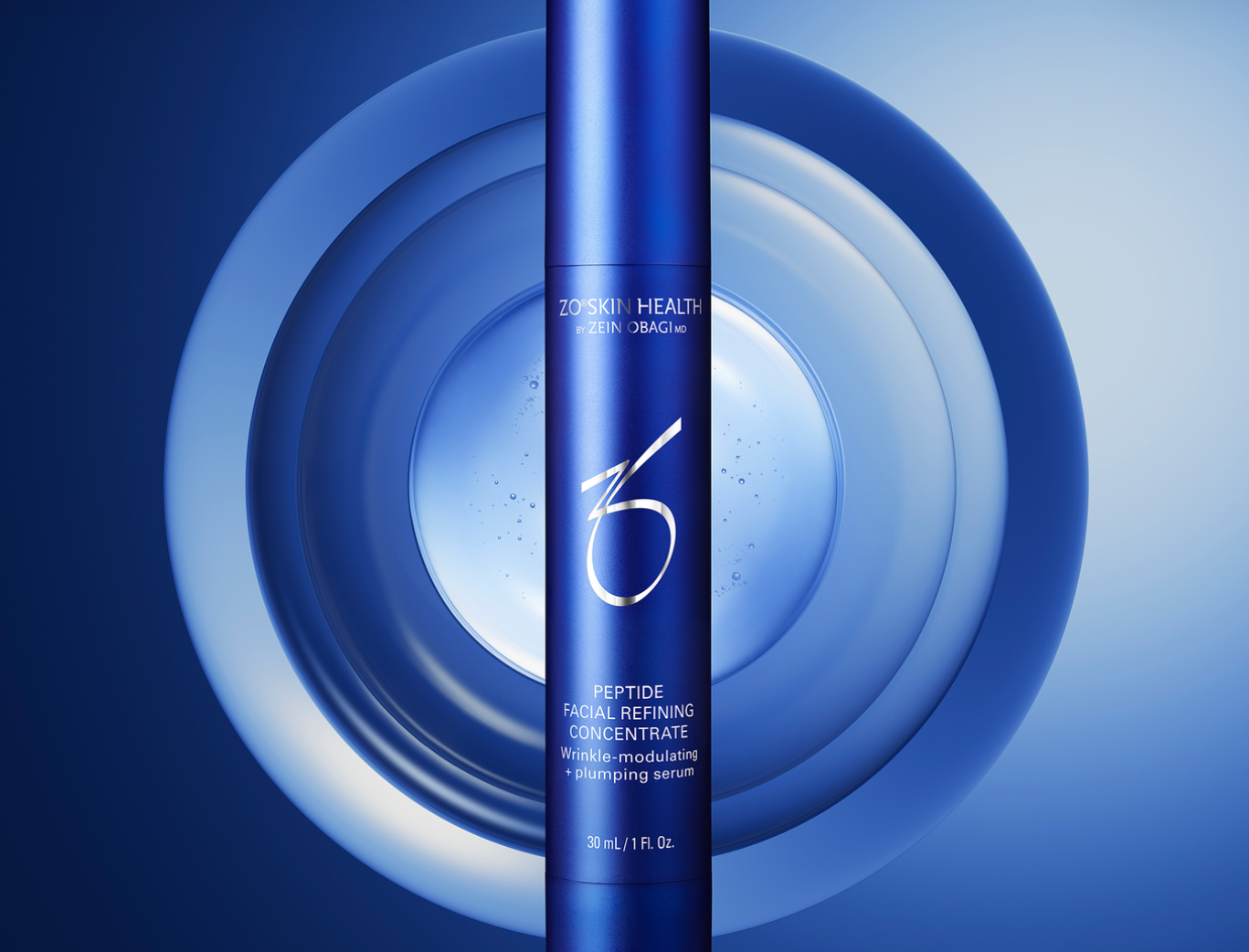 Blue cylindrical skincare product bottle labeled Zo Skin Health Peptide Facial Refining Concentrate, against a blue and white circular graphic background.