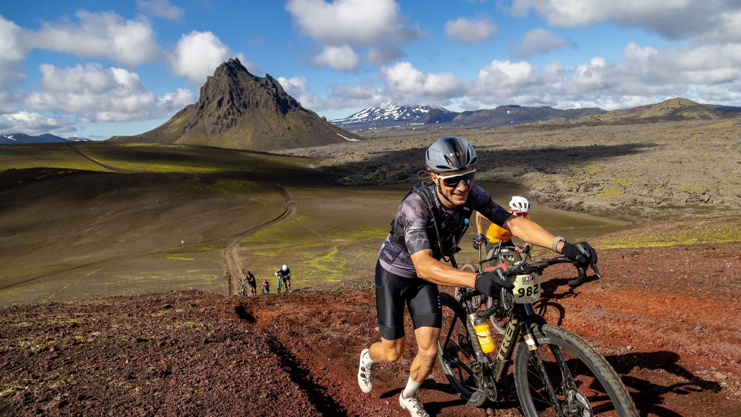 Toms Alsbergs pushing his bike up a volcanic slope at The Rift gravel race in Iceland