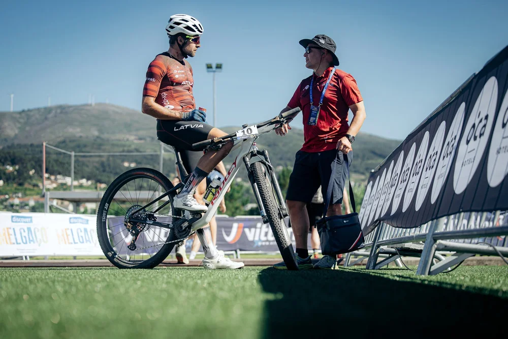 Jānis Mūsiņš coaching a Latvian rider at the 2025 European Championships