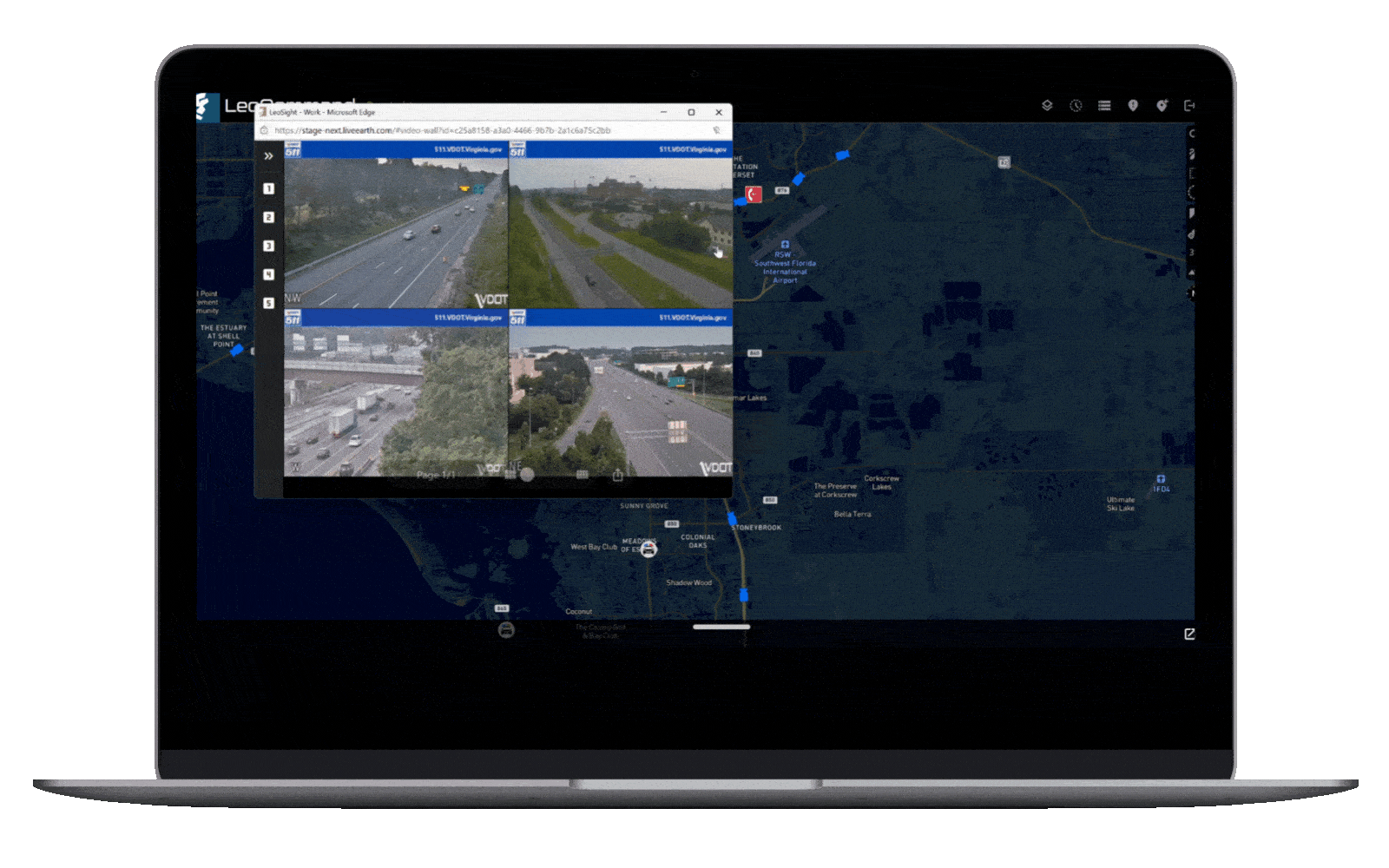 Laptop screen showing a map with multiple live traffic camera feeds overlaid, highlighting different interstate highways and roads.