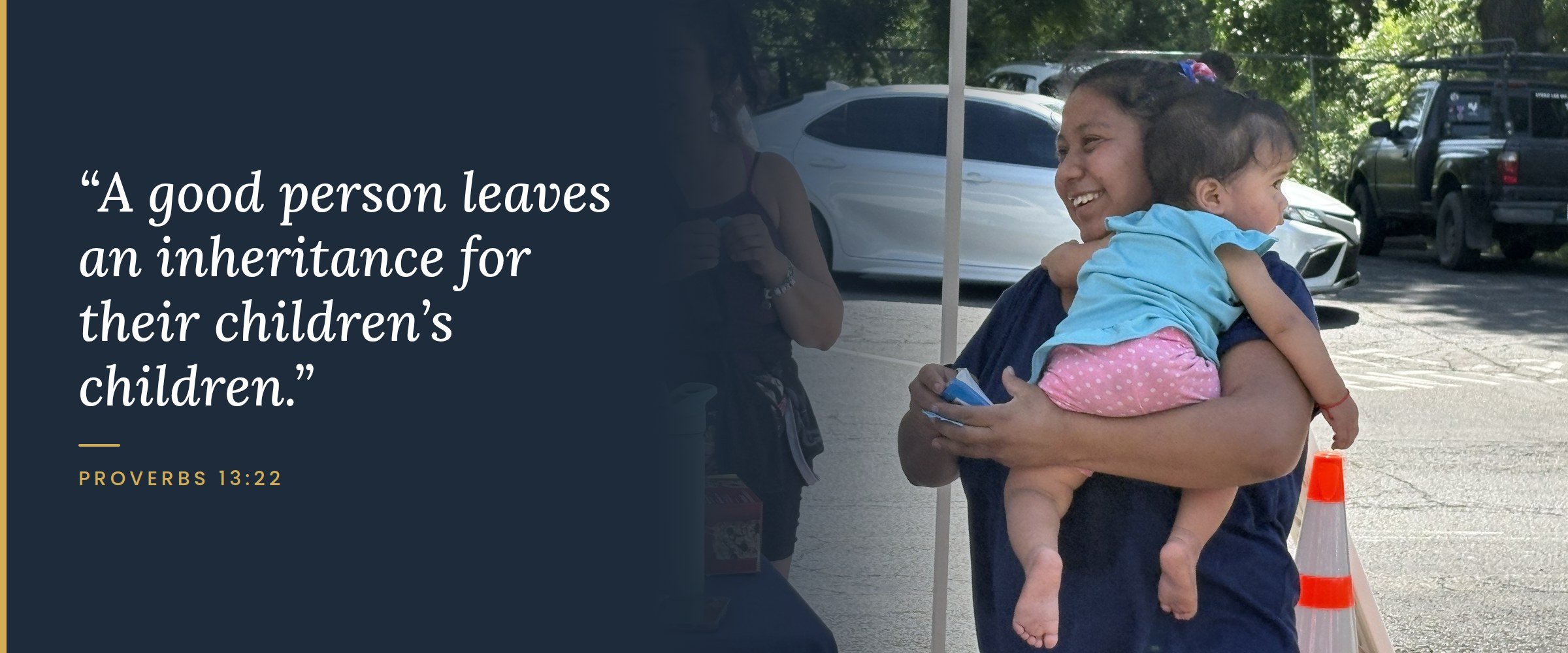 A smiling mother holds her baby at a Mercy & Truth community event beside the verse "A good person leaves an inheritance for their children's children." Proverbs 13:22.