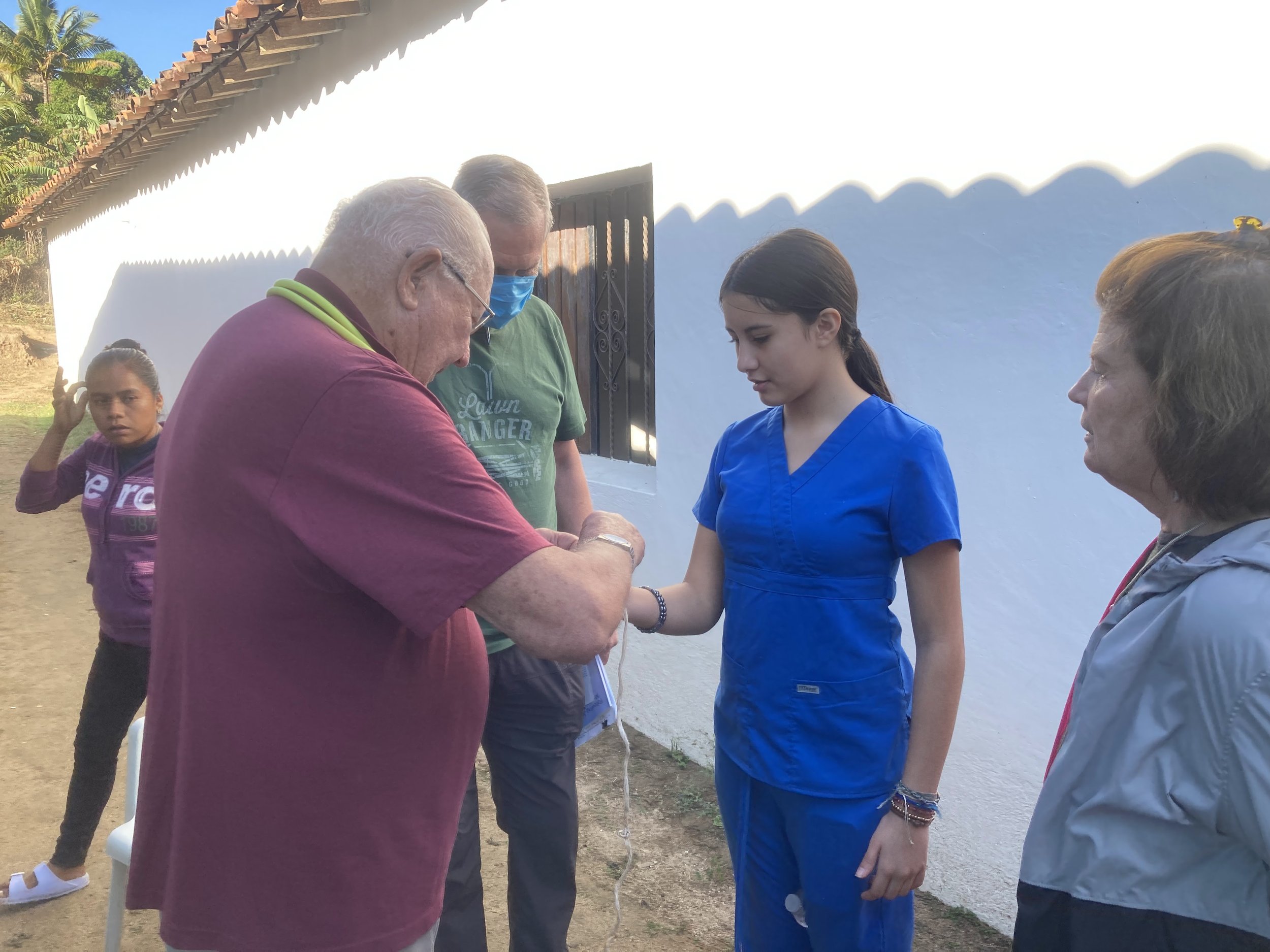 Volunteers and medical staff from Mercy & Truth Medical Missions providing Life-Changing Care and spiritual support during an international trip.