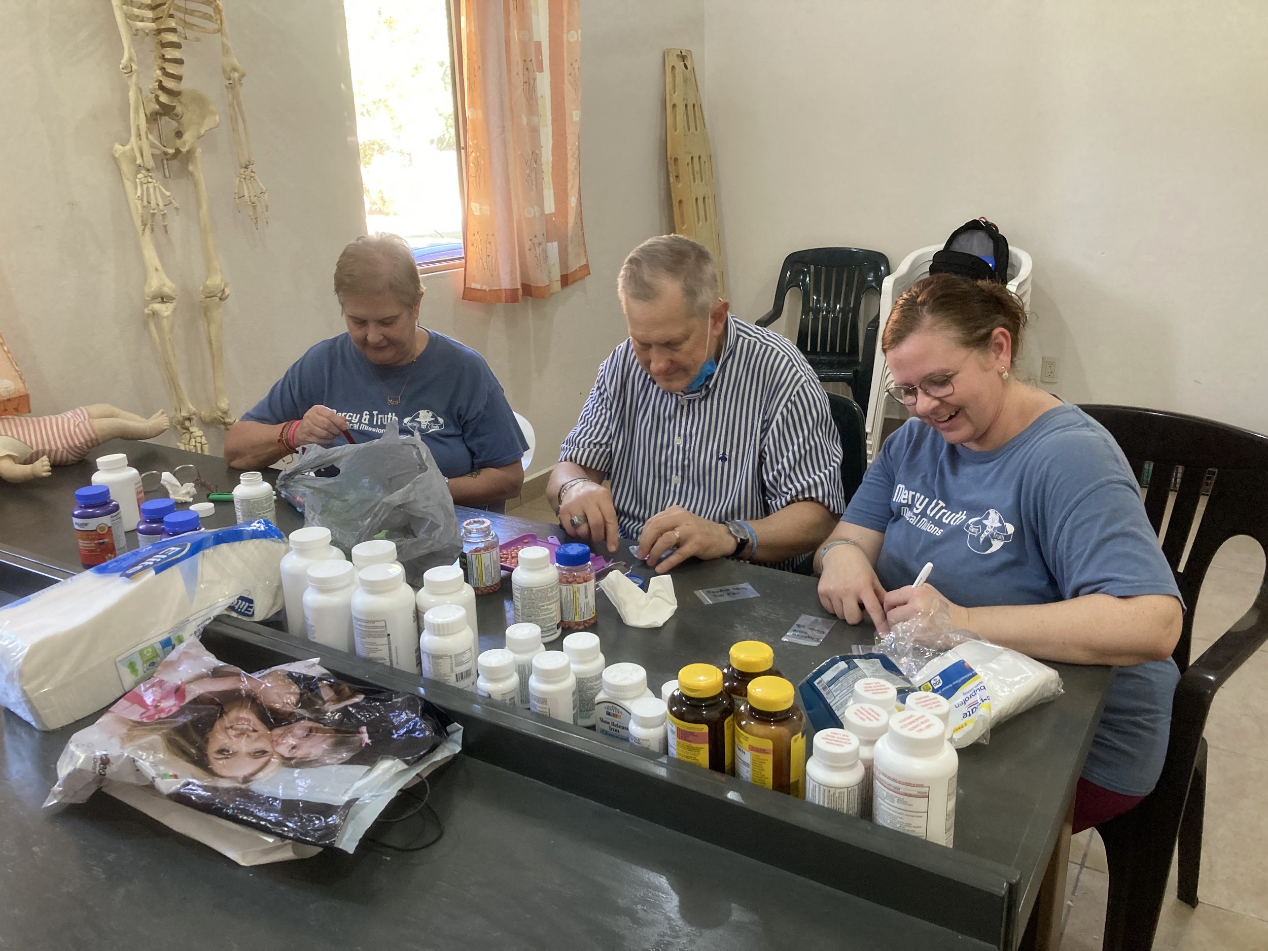 Volunteers and medical staff from Mercy & Truth Medical Missions providing Life-Changing Care and spiritual support during an international trip.