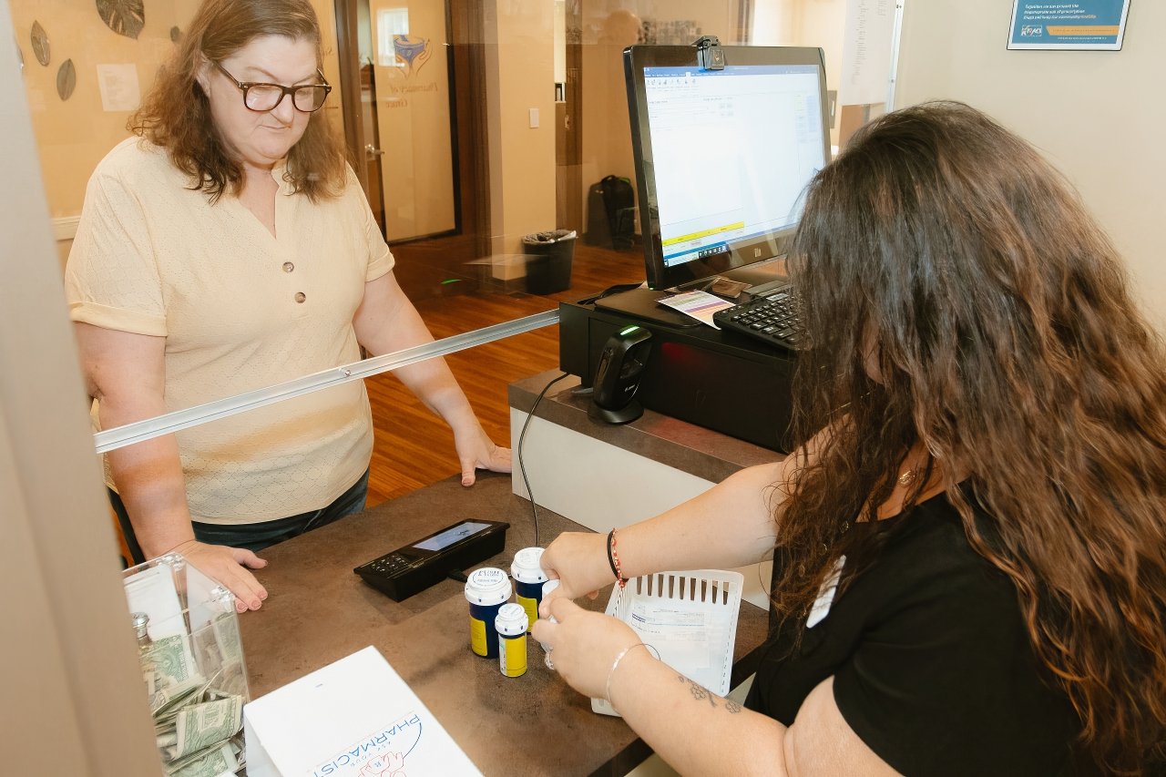 Pharmacy of Grace technician counting pills to fulfill prescriptions for Mercy & Truth Healthcare Ministry’s patients.