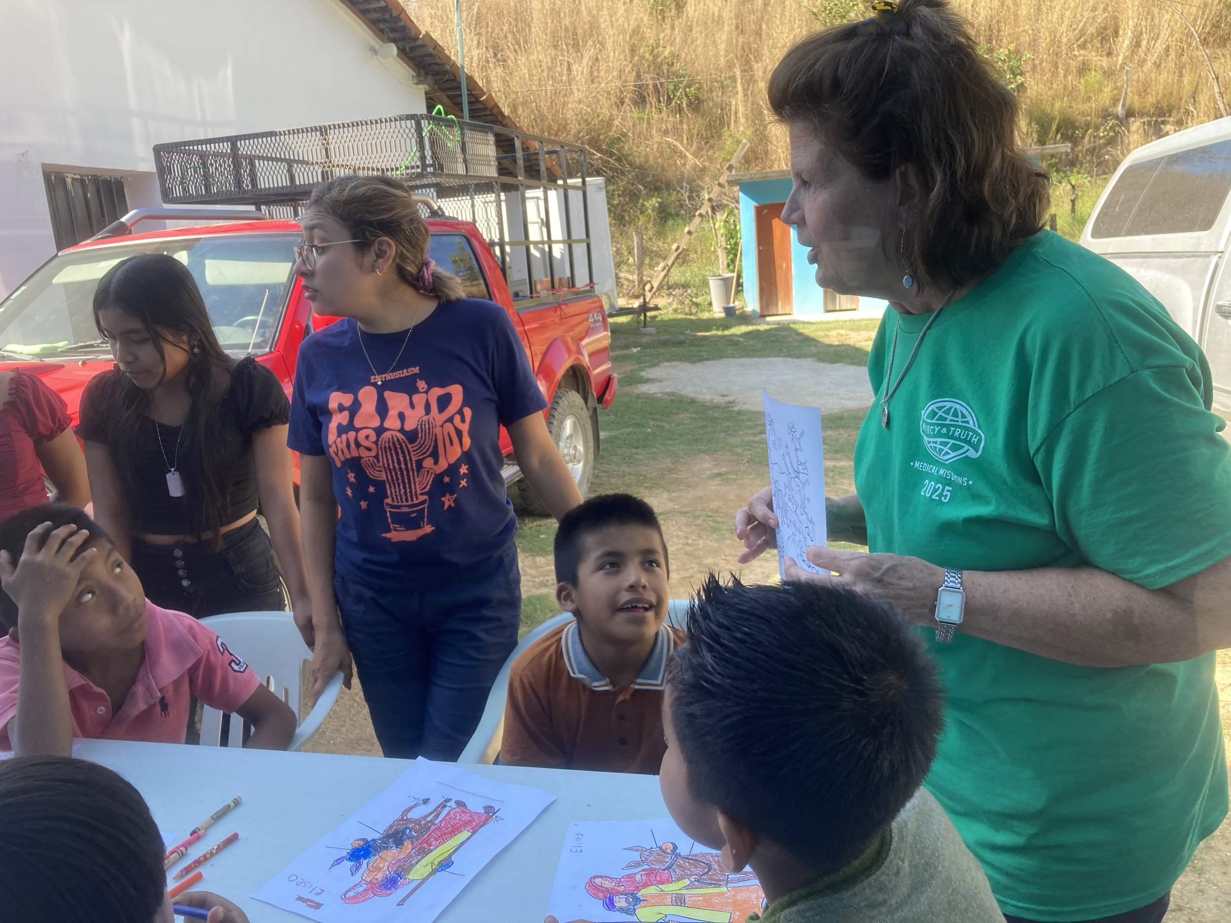 Volunteers and medical staff from Mercy & Truth Medical Missions providing Life-Changing Care and spiritual support during an international trip.