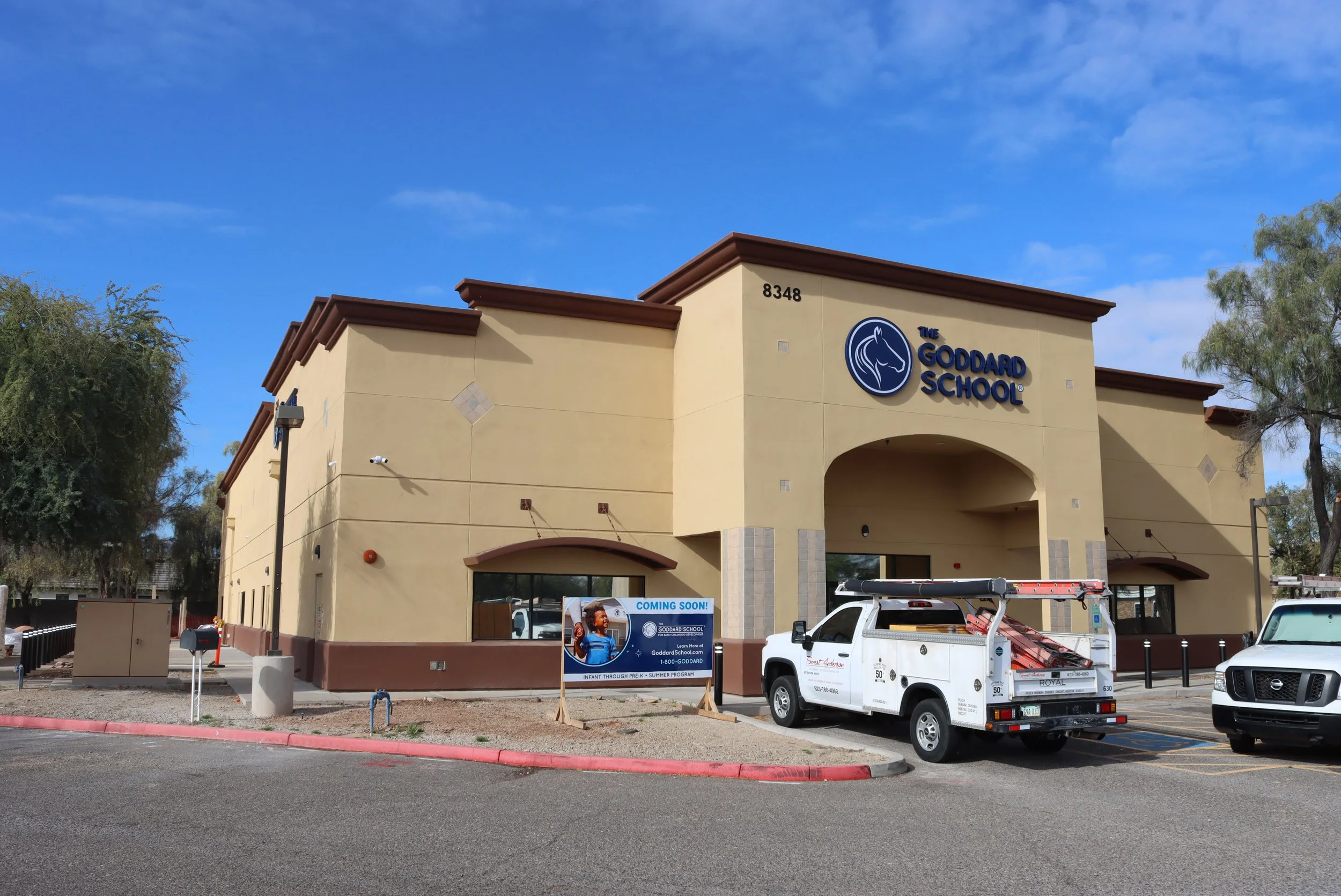 Completed exterior stucco renovation by Bull Plastering at Goddard School, featuring smooth finished stucco walls and updated architectural details under a clear Arizona sky.