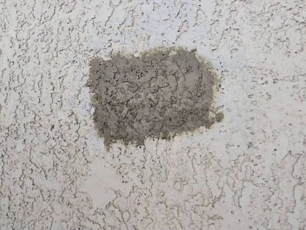 Professional stucco patching and texture matching for a residential home in Goodyear, AZ.