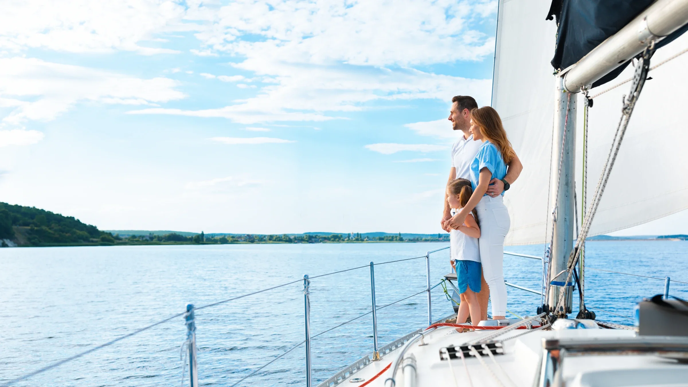 A family enjoying a private sailing experience on Lake Michigan aboard a Waypoint Yachting catamaran.