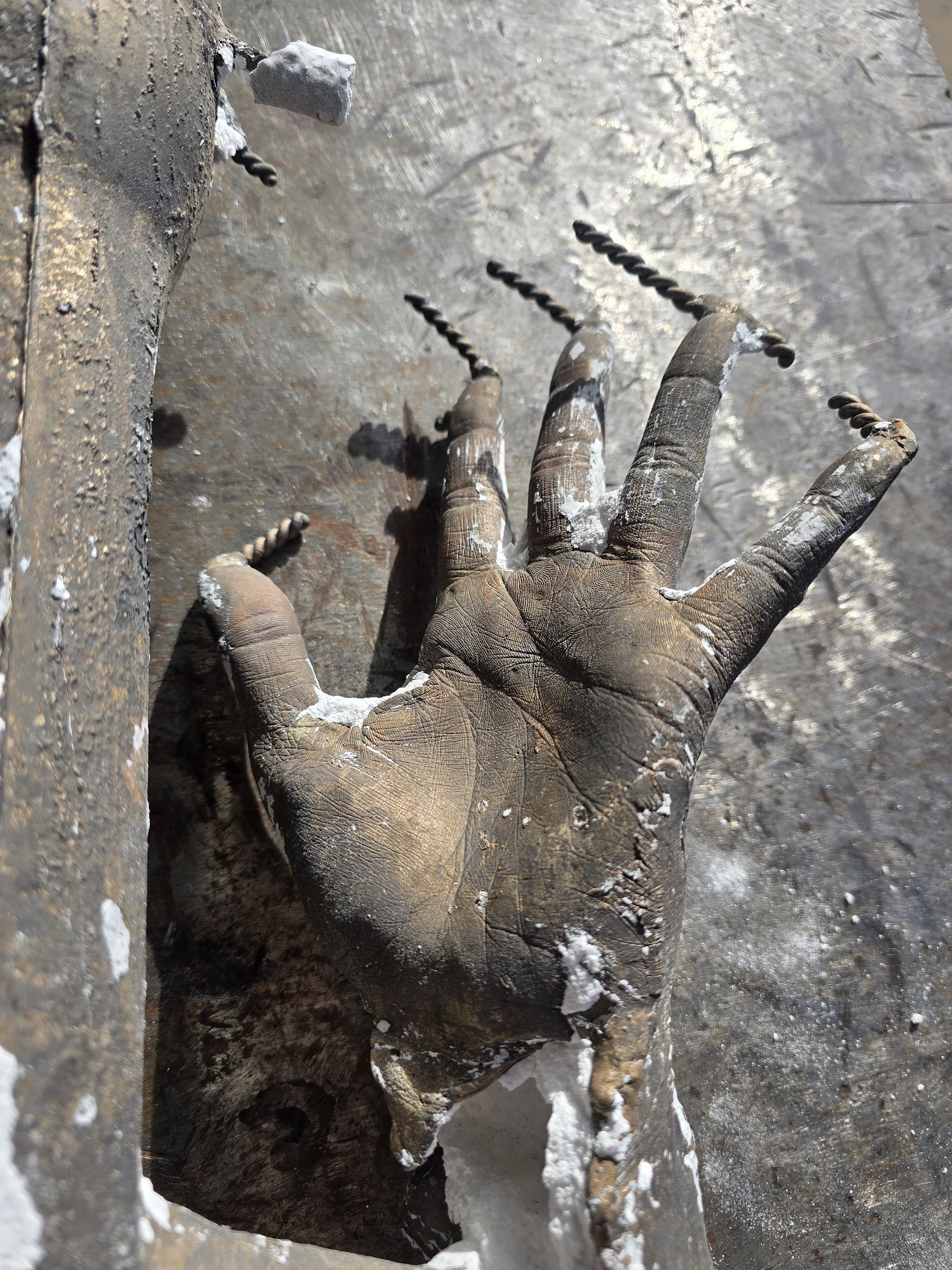 A freshly cast bronze hand