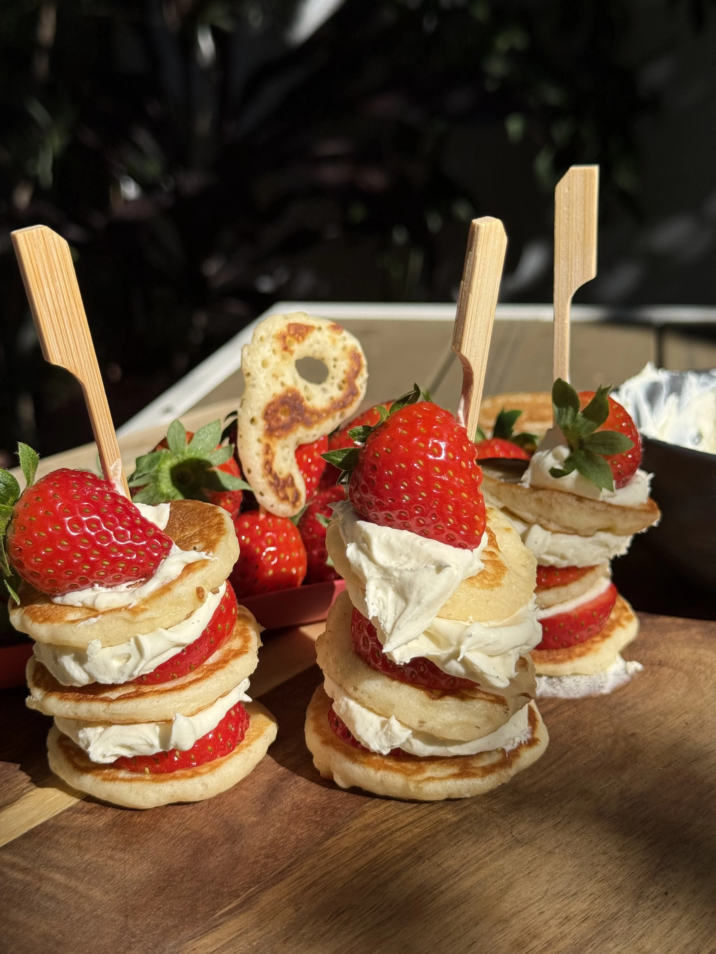 Mini pancake canapés with mascarpone cream and strawberries