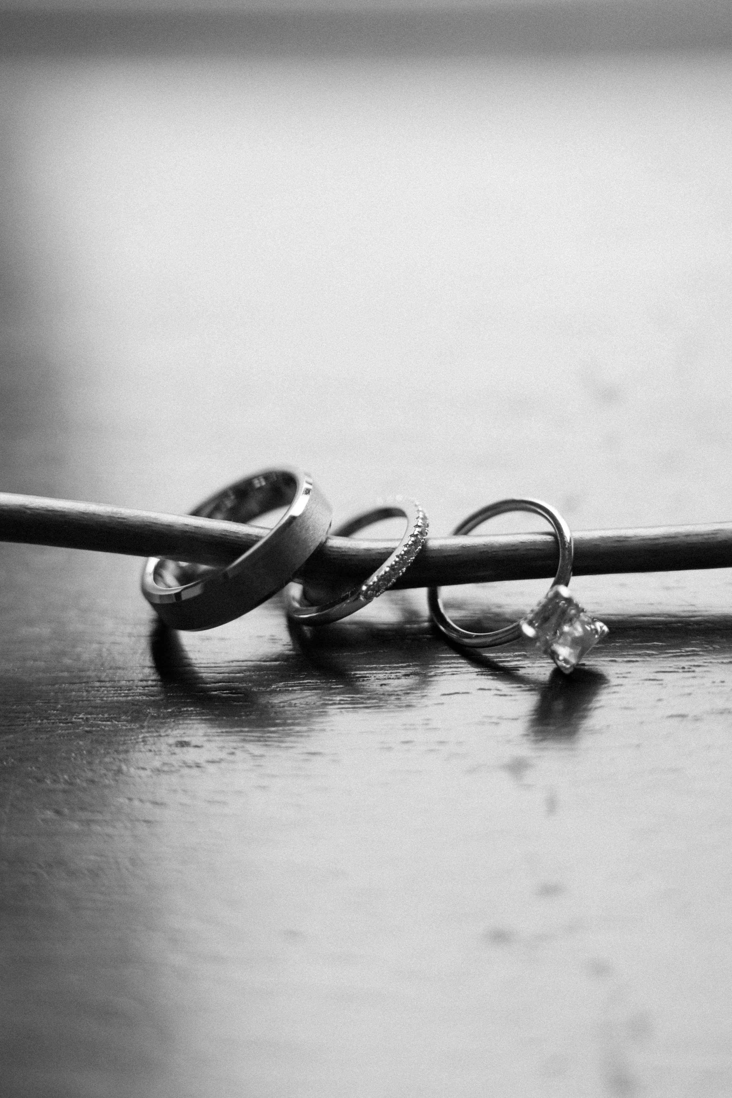 wedding rings displayed through a stem