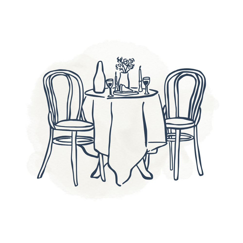 Line drawing of a small round dining table with two chairs, set with a tablecloth, a wine bottle, two wine glasses, and a small vase with flowers.