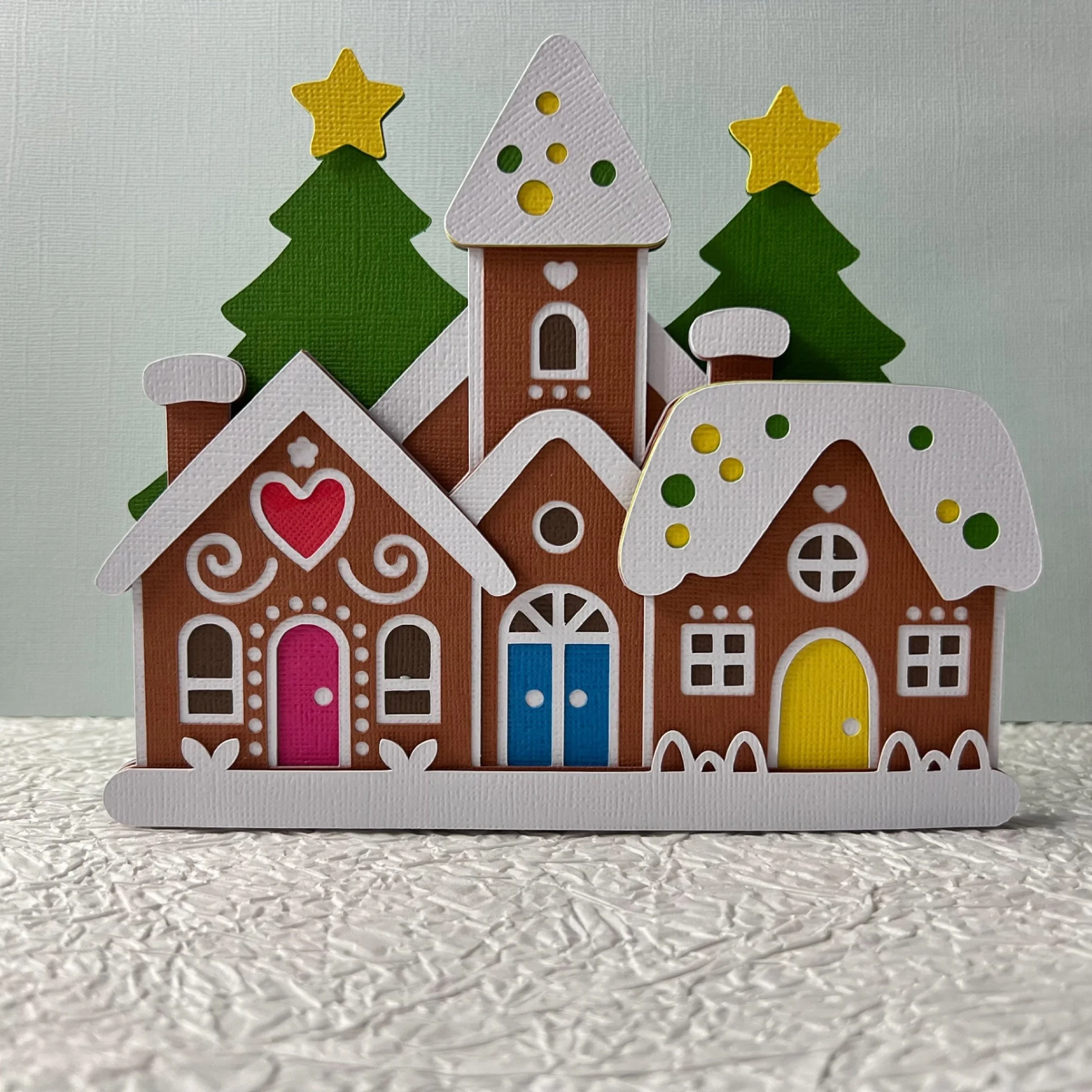 Decorating for the Holidays always brings me so much joy. Loving this cute layered Cardstock Gingerbread Village. 

#gingerbreadhouse #cricutpapercraft #christmasdecor #loveleayer
